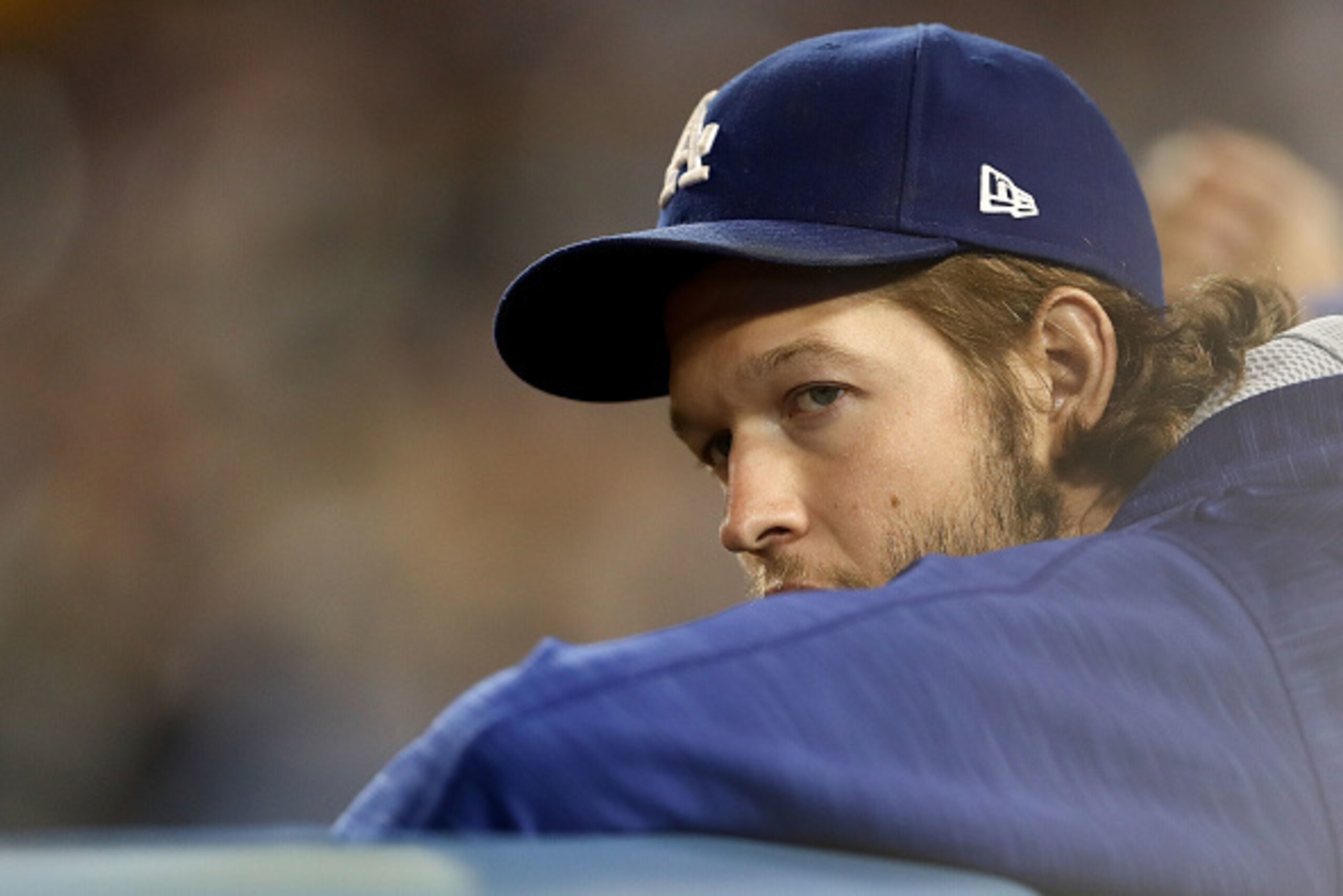 LOS ANGELES, CA - OCTOBER 18:  Clayton Kershaw #22 of the Los Angeles Dodgers looks on from the dugout against the Chicago Cubs in game three of the National League Championship Series at Dodger Stadium on October 18, 2016 in Los Angeles, California.  (Ph