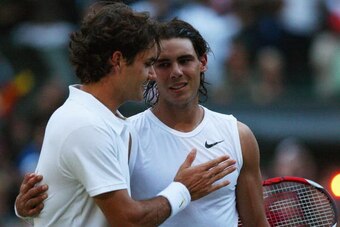 LONDON - JULY 06:  Roger Federer of Switzerland congratulates Rafael Nadal of Spain in winning match point and the Championship during the men's singles Final on day thirteen of the Wimbledon Lawn Tennis Championships at the All England Lawn Tennis and Cr