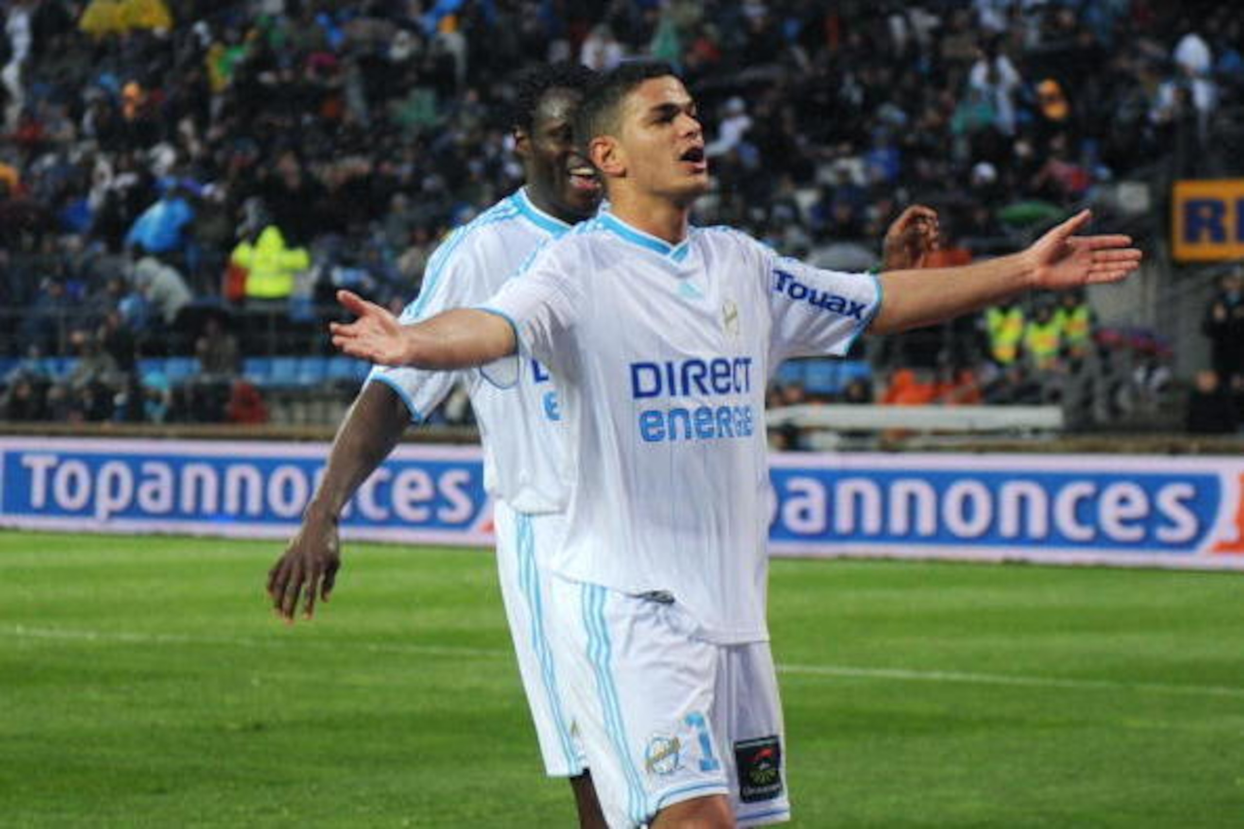 Marseille's forward Hatem Ben Arfa (R) jubilates during the French L1 football match Marseille vs Sochaux at Velodrome stadium on April 7, 2010 in Marseille, southern France. AFP PHOTO / MICHEL GANGNE (Photo credit should read MICHEL GANGNE/AFP/Getty Imag