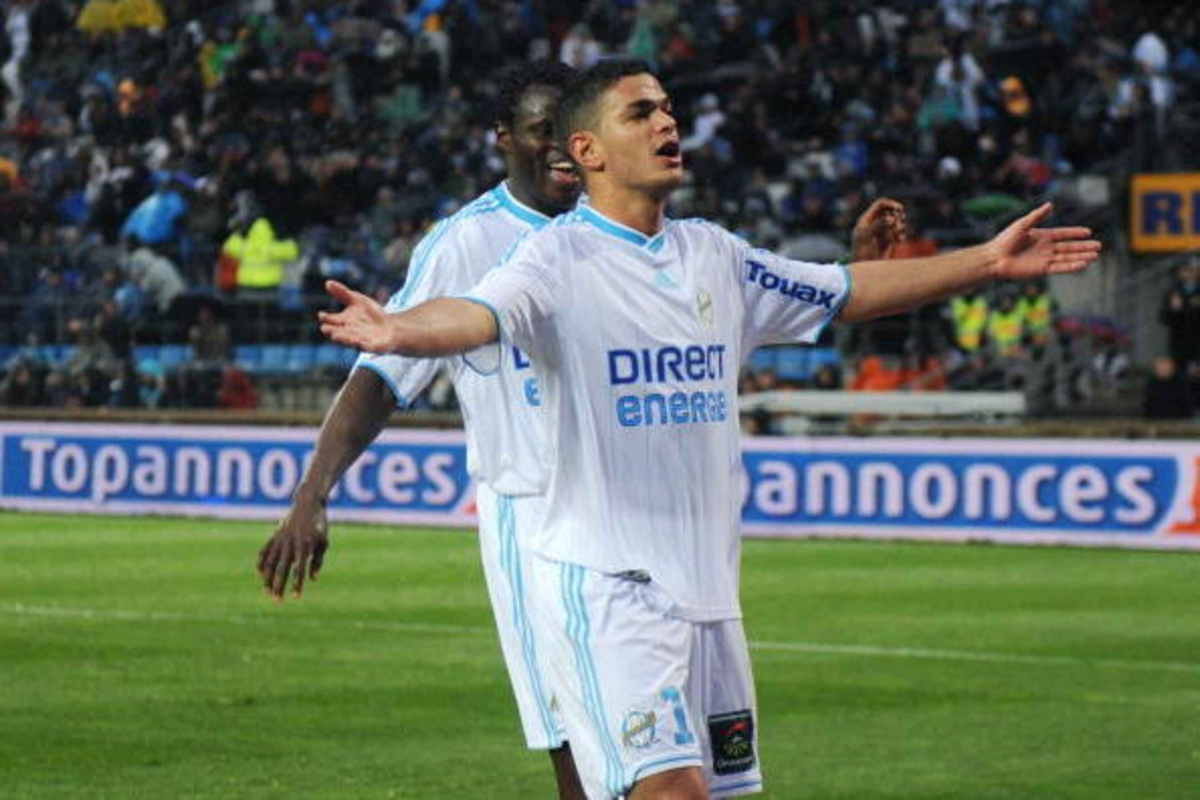 Marseille's forward Hatem Ben Arfa (R) jubilates during the French L1 football match Marseille vs Sochaux at Velodrome stadium on April 7, 2010 in Marseille, southern France. AFP PHOTO / MICHEL GANGNE (Photo credit should read MICHEL GANGNE/AFP/Getty Imag