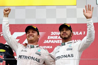 SUZUKA, JAPAN - OCTOBER 09: Nico Rosberg of Germany and Mercedes GP and Lewis Hamilton of Great Britain and Mercedes GP on the podium during the Formula One Grand Prix of Japan at Suzuka Circuit on October 9, 2016 in Suzuka.  (Photo by Clive Mason/Getty I
