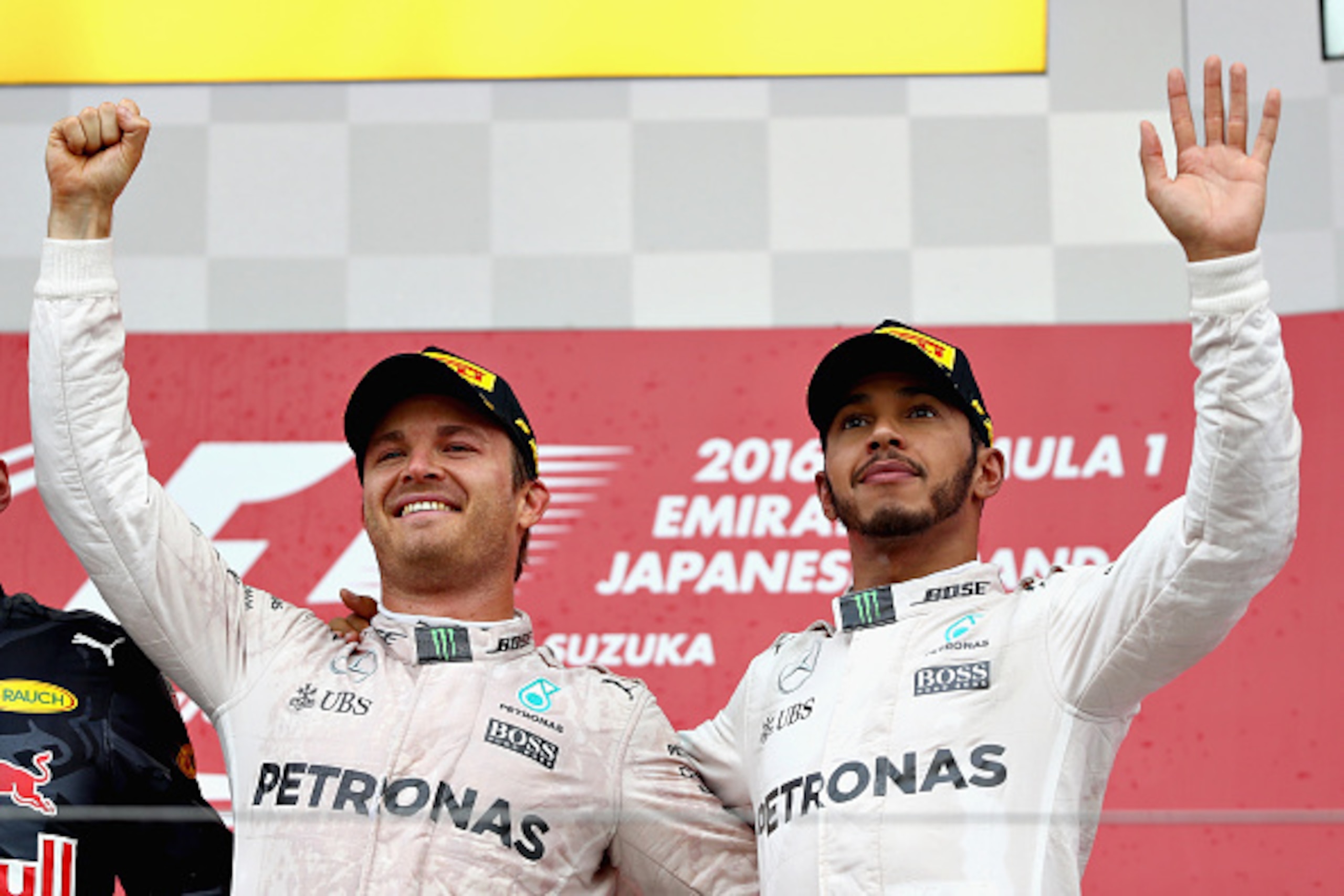 SUZUKA, JAPAN - OCTOBER 09: Nico Rosberg of Germany and Mercedes GP and Lewis Hamilton of Great Britain and Mercedes GP on the podium during the Formula One Grand Prix of Japan at Suzuka Circuit on October 9, 2016 in Suzuka.  (Photo by Clive Mason/Getty I
