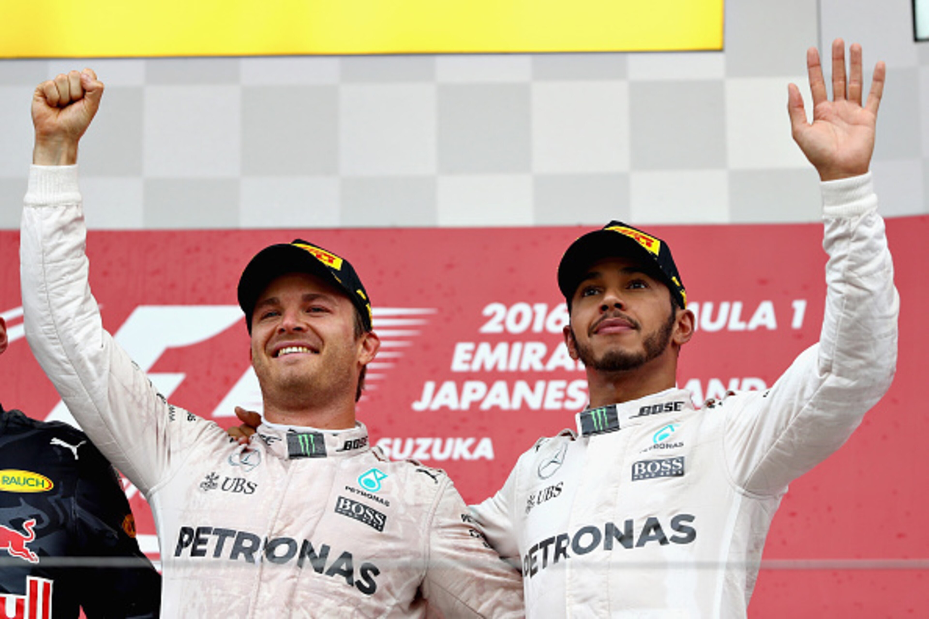SUZUKA, JAPAN - OCTOBER 09: Nico Rosberg of Germany and Mercedes GP and Lewis Hamilton of Great Britain and Mercedes GP on the podium during the Formula One Grand Prix of Japan at Suzuka Circuit on October 9, 2016 in Suzuka.  (Photo by Clive Mason/Getty I