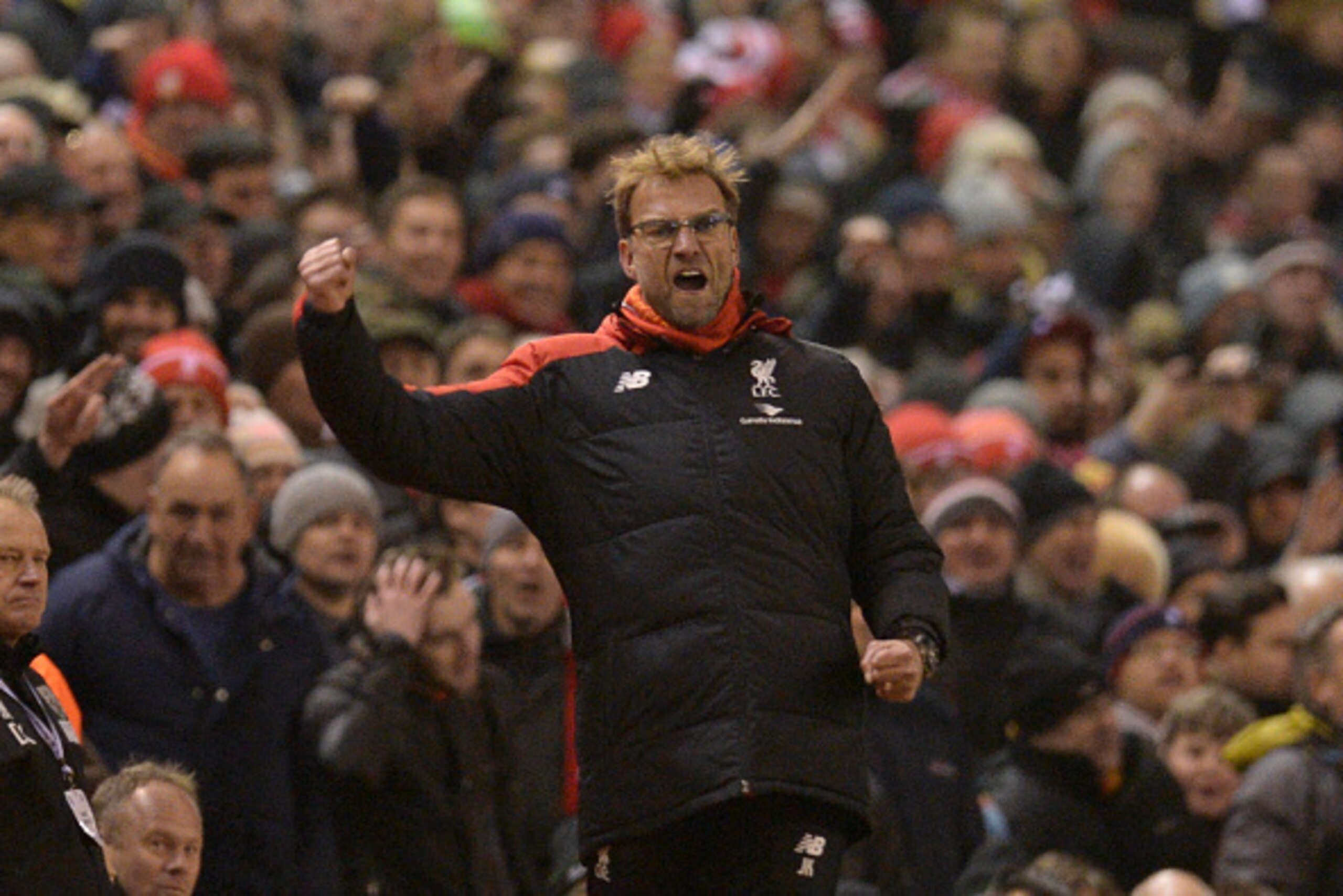 Liverpool's German manager Jurgen Klopp celebrates their late equalising goal to level the score at 2-2 the English Premier League football match between Liverpool and West Bromwich Albion at Anfield in Liverpool, northwest England, on December 13, 2015. 