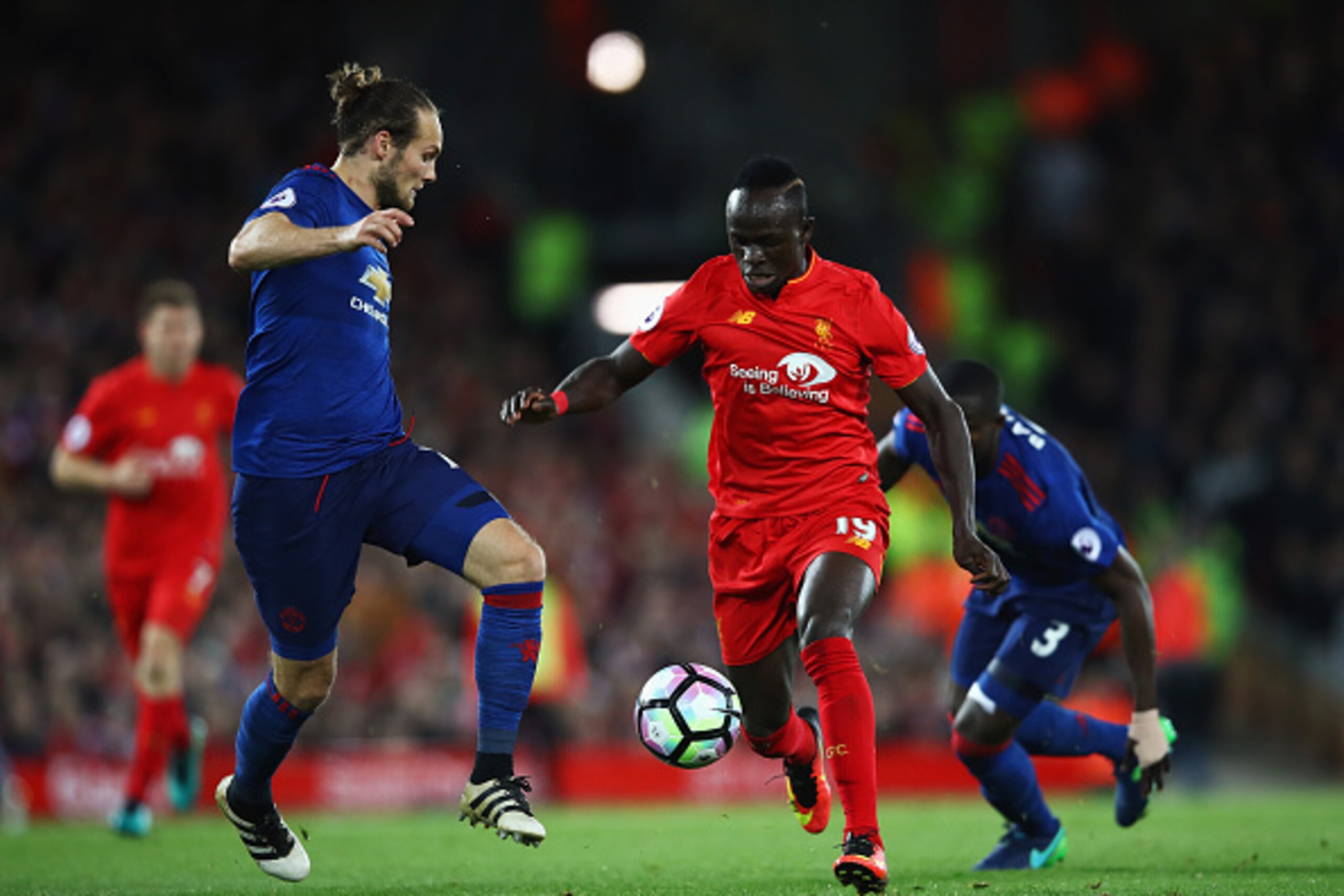 LIVERPOOL, ENGLAND - OCTOBER 17: Sadio Mane of Liverpool takes on Daley Blind of Manchester United during the Premier League match between Liverpool and Manchester United at Anfield on October 17, 2016 in Liverpool, England.  (Photo by Clive Brunskill/Get