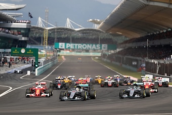 KUALA LUMPUR, MALAYSIA - OCTOBER 02:  Lewis Hamilton of Great Britain driving the (44) Mercedes AMG Petronas F1 Team Mercedes F1 WO7 Mercedes PU106C Hybrid turbo, Nico Rosberg of Germany driving the (6) Mercedes AMG Petronas F1 Team Mercedes F1 WO7 Merced