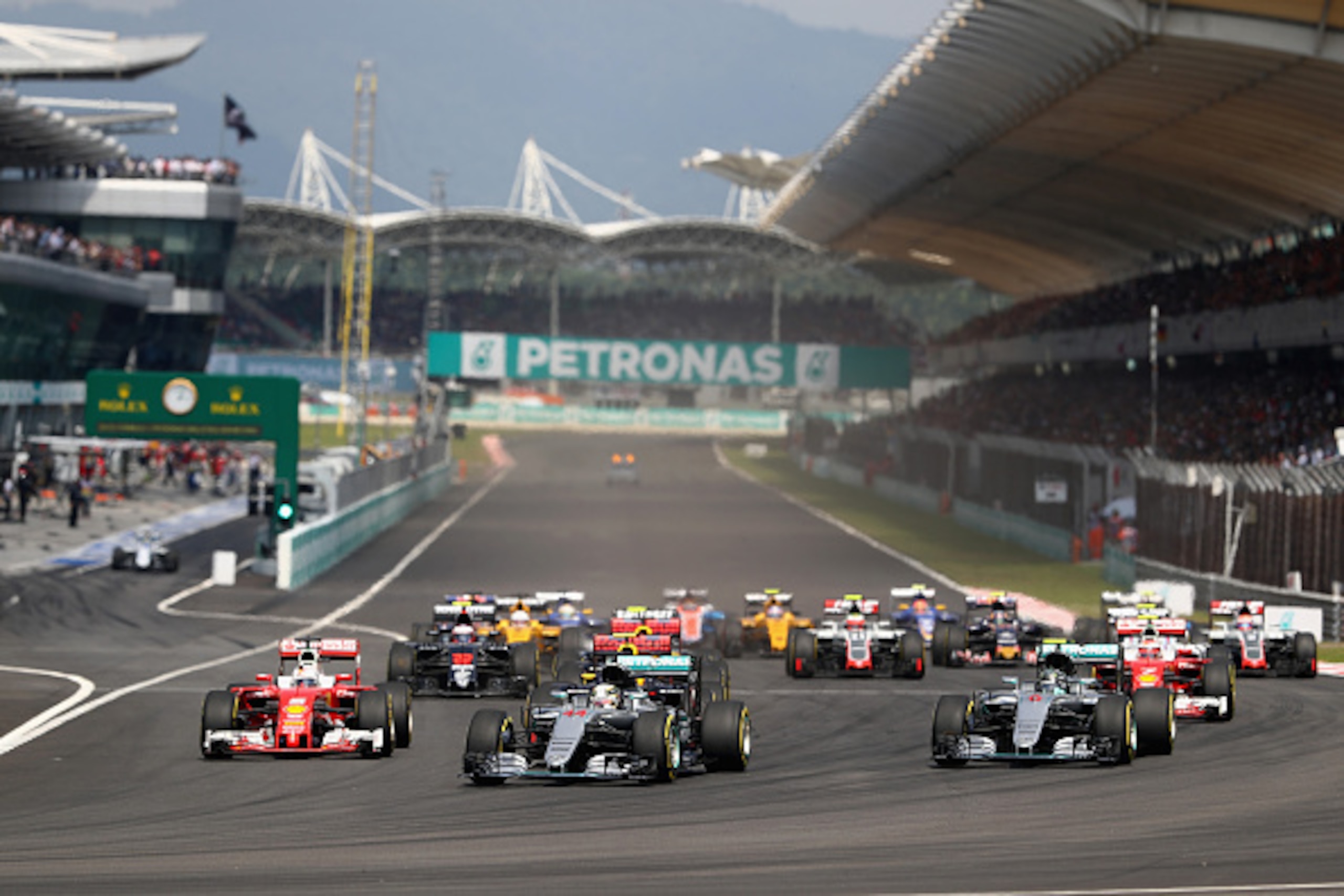 KUALA LUMPUR, MALAYSIA - OCTOBER 02:  Lewis Hamilton of Great Britain driving the (44) Mercedes AMG Petronas F1 Team Mercedes F1 WO7 Mercedes PU106C Hybrid turbo, Nico Rosberg of Germany driving the (6) Mercedes AMG Petronas F1 Team Mercedes F1 WO7 Merced
