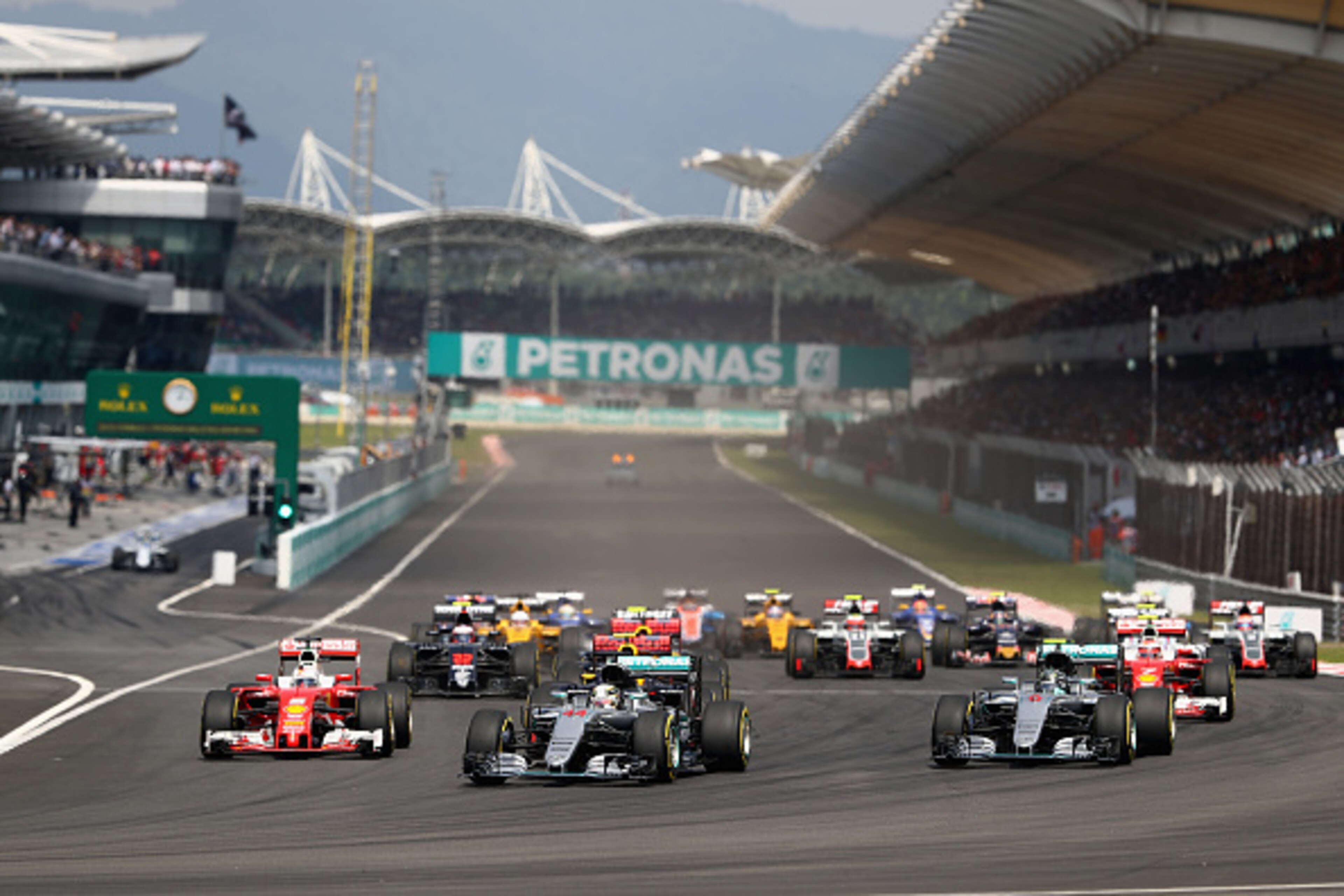 KUALA LUMPUR, MALAYSIA - OCTOBER 02:  Lewis Hamilton of Great Britain driving the (44) Mercedes AMG Petronas F1 Team Mercedes F1 WO7 Mercedes PU106C Hybrid turbo, Nico Rosberg of Germany driving the (6) Mercedes AMG Petronas F1 Team Mercedes F1 WO7 Merced