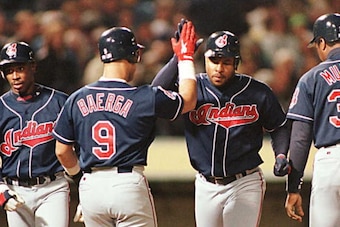 OAKLAND, UNITED STATES:  Cleveland Indians Albert Belle (2nd R) is greeted by teammates Carlos Baerga (2nd L), Kenny Lofton (L) and Eddie Murray (R) after Belle hit a three-run homerun off Oakland Athletics starting pitcher Carlos Reyes 08 May in Oakland,