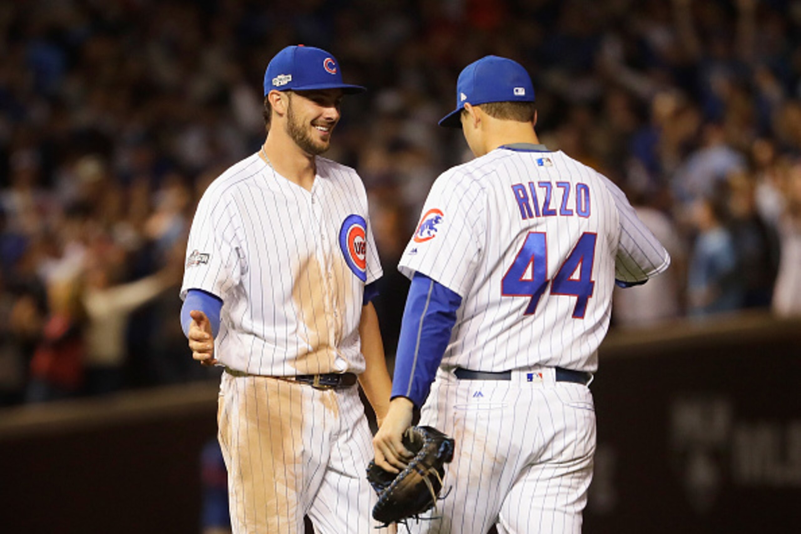 CHICAGO, IL - OCTOBER 15:  Kris Bryant #17 of the Chicago Cubs celebrates with Anthony Rizzo #44 after defeating the Los Angeles Dodgers 8-4 in game one of the National League Championship Series at Wrigley Field on October 15, 2016 in Chicago, Illinois. 