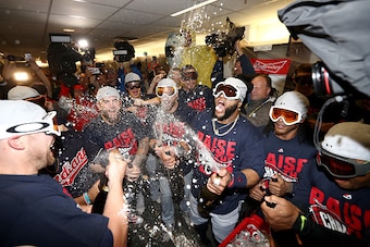 TORONTO, ON - OCTOBER 19:  Carlos Santana #41 of the Cleveland Indians celebrates with his teammates in the locker room after defeating the Toronto Blue Jays with a score of 3 to 0 in game five to win the American League Championship Series at Rogers Cent