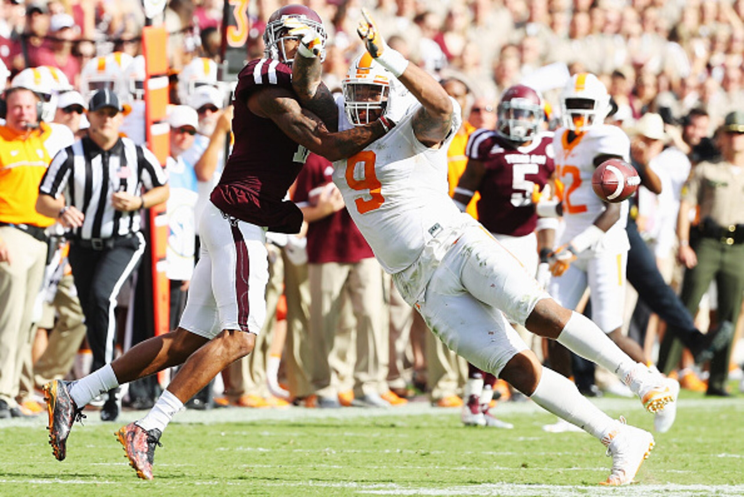 COLLEGE STATION, TX - OCTOBER 08: Josh Reynolds #11 of the Texas A&M Aggies and Derek Barnett #9 of the Tennessee Volunteers battle for the football during their game at Kyle Field on October 8, 2016 in College Station, Texas.  (Photo by Scott Halleran/Ge