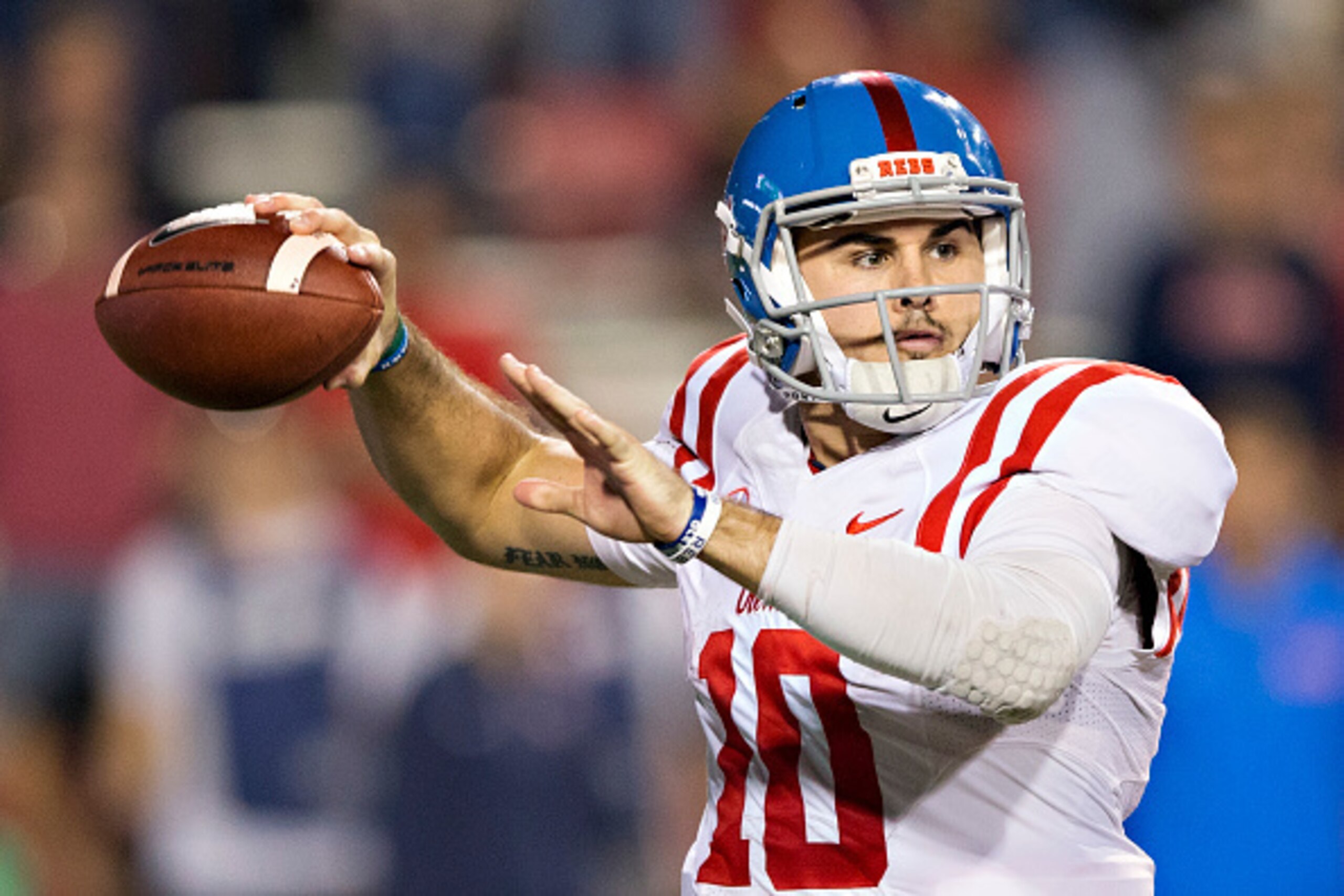 FAYETTEVILLE, AR - OCTOBER15:  Chad Kelly #10 of the Mississippi Rebels throws a pass during a game against the Arkansas Razorbacks at Razorback Stadium on October 15, 2016 in Fayetteville, Arkansas.  The Razorbacks defeated the Rebels 34-30.  (Photo by W