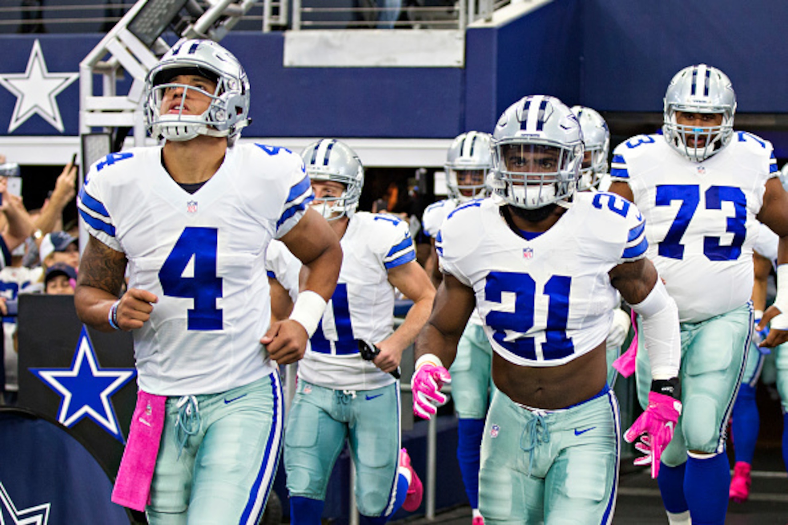 ARLINGTON, TX - OCTOBER 09: Ezekiel Elliott #21 and Dak Prescott #4 run onto the field before a game against the Cincinnati Bengals at AT&T Stadium on October 9, 2016 in Arlington, Texas. The Cowboys defeated the Bengals 28-14. (Photo by Wesley Hitt/Gett ARLINGTON, TX - OCTOBER 09: Ezekiel Elliott #21 and Dak Prescott #4 run onto the field before a game against the Cincinnati Bengals at AT&T Stadium on October 9, 2016 in Arlington, Texas. The Cowboys defeated the Bengals 28-14. (Photo by Wesley Hitt/Gett