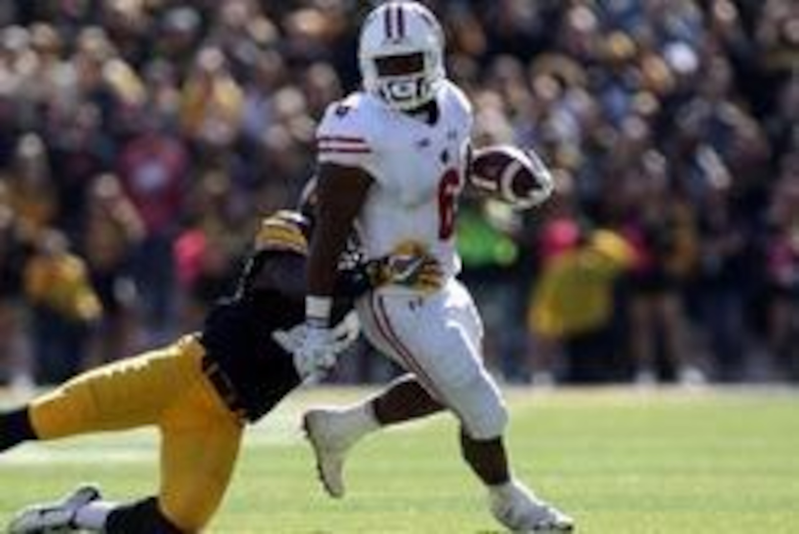 Oct 22, 2016; Iowa City, IA, USA; Iowa Hawkeyes defensive back Desmond King (14) tackles Wisconsin Badgers running back Corey Clement (6) at Kinnick Stadium. The Badgers beat the Hawkeyes 17 to 9.  Mandatory Credit: Reese Strickland-USA TODAY Sports