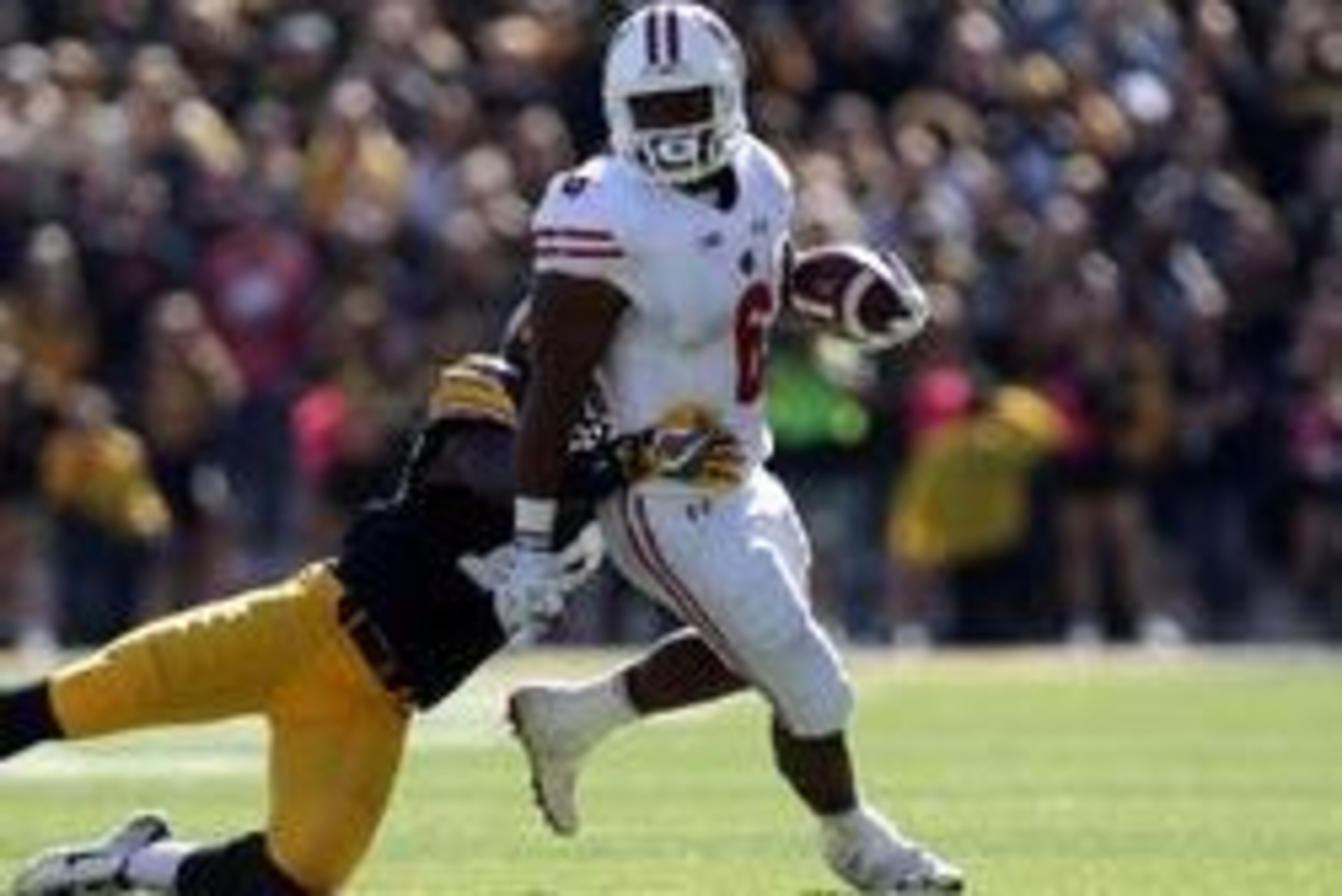 Oct 22, 2016; Iowa City, IA, USA; Iowa Hawkeyes defensive back Desmond King (14) tackles Wisconsin Badgers running back Corey Clement (6) at Kinnick Stadium. The Badgers beat the Hawkeyes 17 to 9.  Mandatory Credit: Reese Strickland-USA TODAY Sports