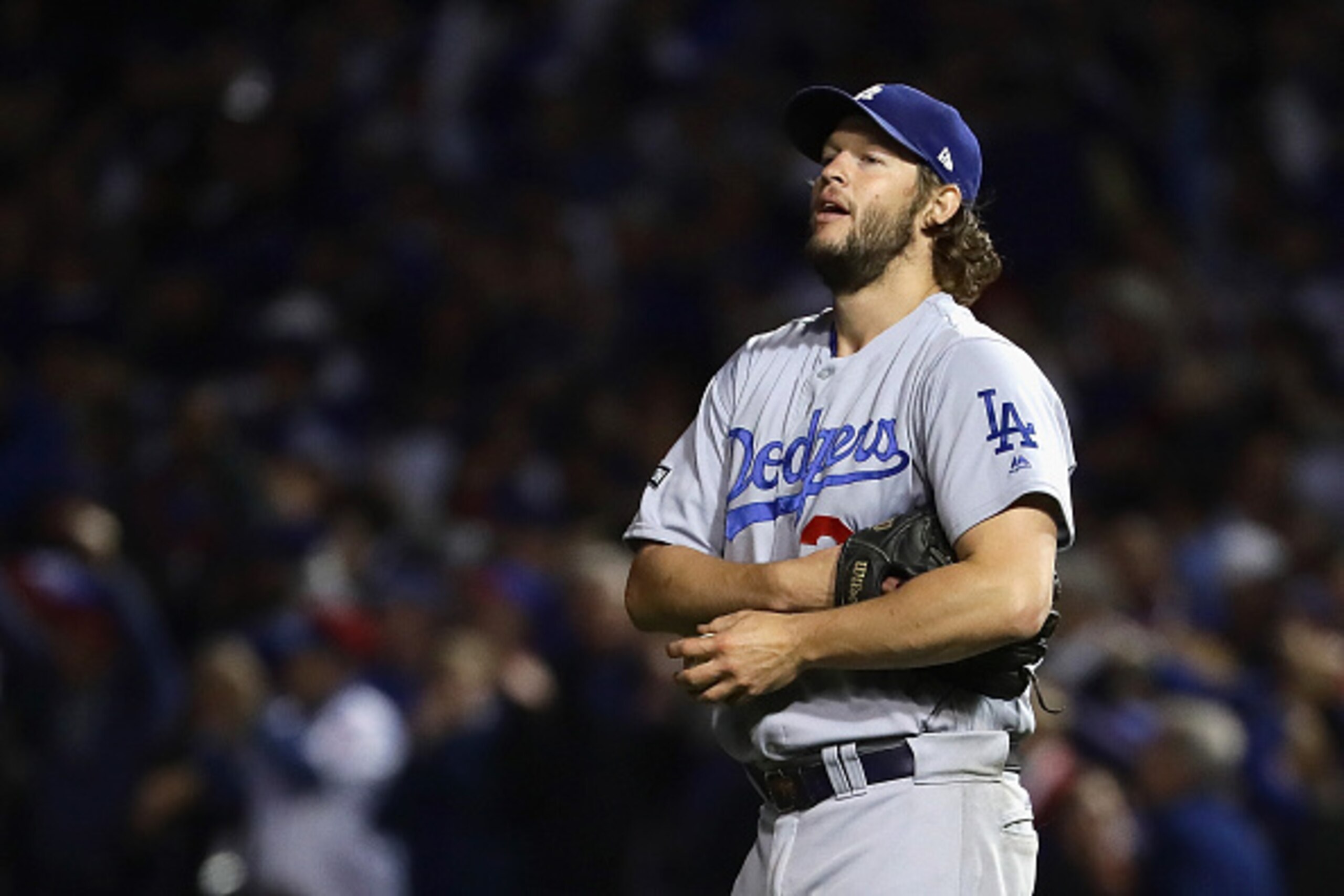 CHICAGO, IL - OCTOBER 22: Clayton Kershaw #22 of the Los Angeles Dodgers reacts after a solo home run by Anthony Rizzo #44 of the Chicago Cubs (not pictured) in the fifth inning during game six of the National League Championship Series at Wrigley Field CHICAGO, IL - OCTOBER 22: Clayton Kershaw #22 of the Los Angeles Dodgers reacts after a solo home run by Anthony Rizzo #44 of the Chicago Cubs (not pictured) in the fifth inning during game six of the National League Championship Series at Wrigley Field