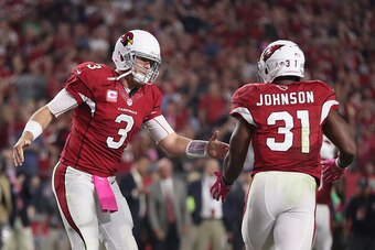 GLENDALE, AZ - OCTOBER 17:  Quarterback Carson Palmer #3 of the Arizona Cardinals congratulates running back David Johnson #31 after Johnson rushed the football two yards for a touchdown in the third quarter against the New York Jets at the University of 