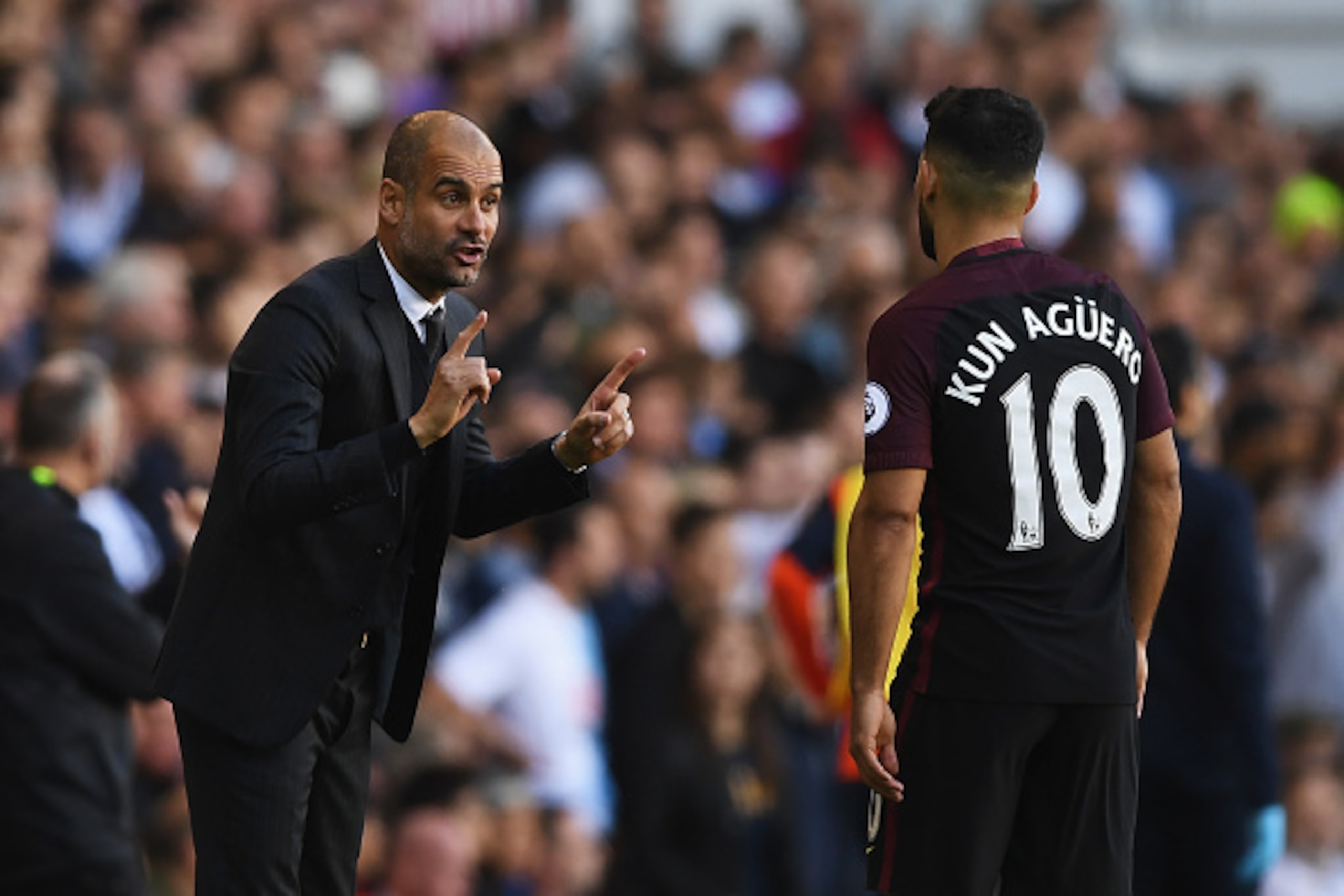 LONDON, ENGLAND - OCTOBER 02:  Josep Guardiola, Manager of Manchester City (L) gives Sergio Aguero of Manchester City (R) instructions during the Premier League match between Tottenham Hotspur and Manchester City at White Hart Lane on October 2, 2016 in L