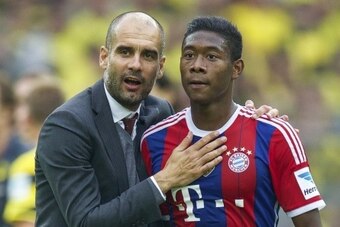 (L-R) coach Pep Guardiola of Bayern Munich, David Alaba of Bayern Munich during the DFL Supercup 2014 match between Bayern Munich on August 13, 2014 at the Signal Iduna Park stadium in Dortmund, Germany.(Photo by VI Images via Getty Images)