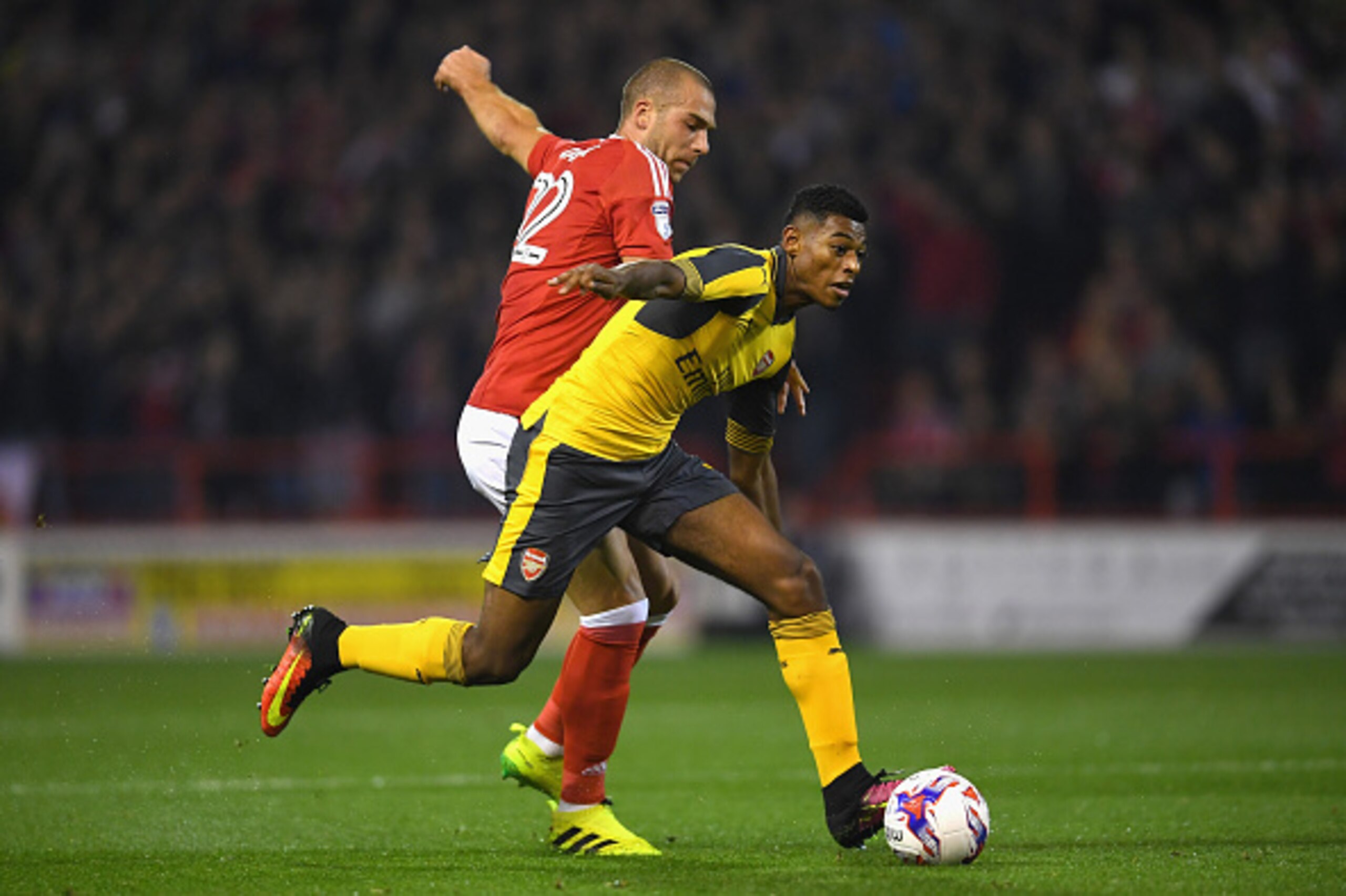 NOTTINGHAM, ENGLAND - SEPTEMBER 20: Jeff Reine-Adelaide of Arsenal takes on Pajtim Kasami of Nottingham Forest during the EFL Cup Third Round match between Nottingham Forest and Arsenal at City Ground on September 20, 2016 in Nottingham, England. (Photo NOTTINGHAM, ENGLAND - SEPTEMBER 20: Jeff Reine-Adelaide of Arsenal takes on Pajtim Kasami of Nottingham Forest during the EFL Cup Third Round match between Nottingham Forest and Arsenal at City Ground on September 20, 2016 in Nottingham, England. (Photo