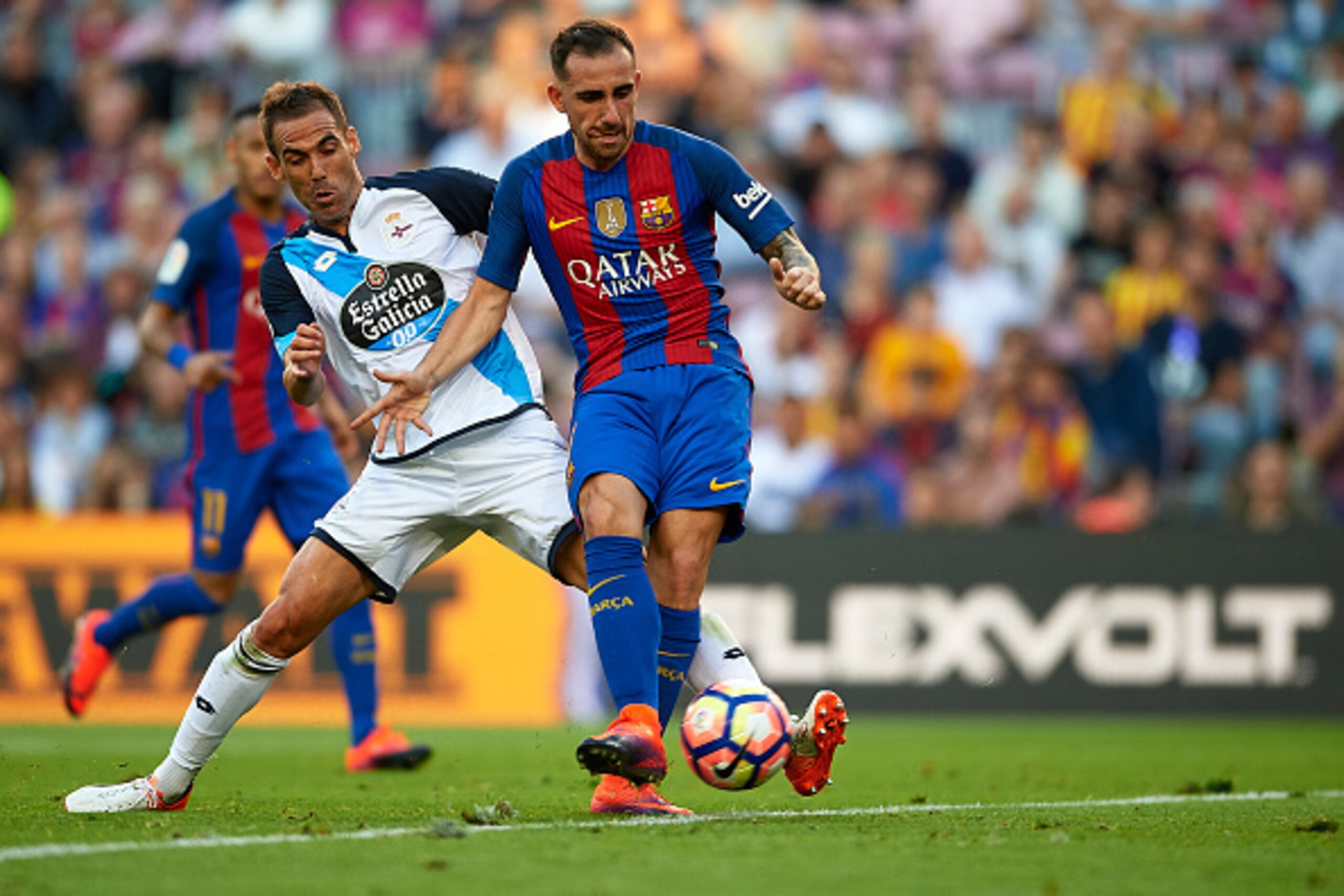 BARCELONA, SPAIN - OCTOBER 15:  Paco Alcacer (R) of FC Barcelona is tackled by Fernando Navarro of Deportivo de La Coruna during the La Liga match between FC Barcelona and RC Deportivo de La Coruna at Camp Nou stadium on October 15, 2016 in Barcelona, Spa