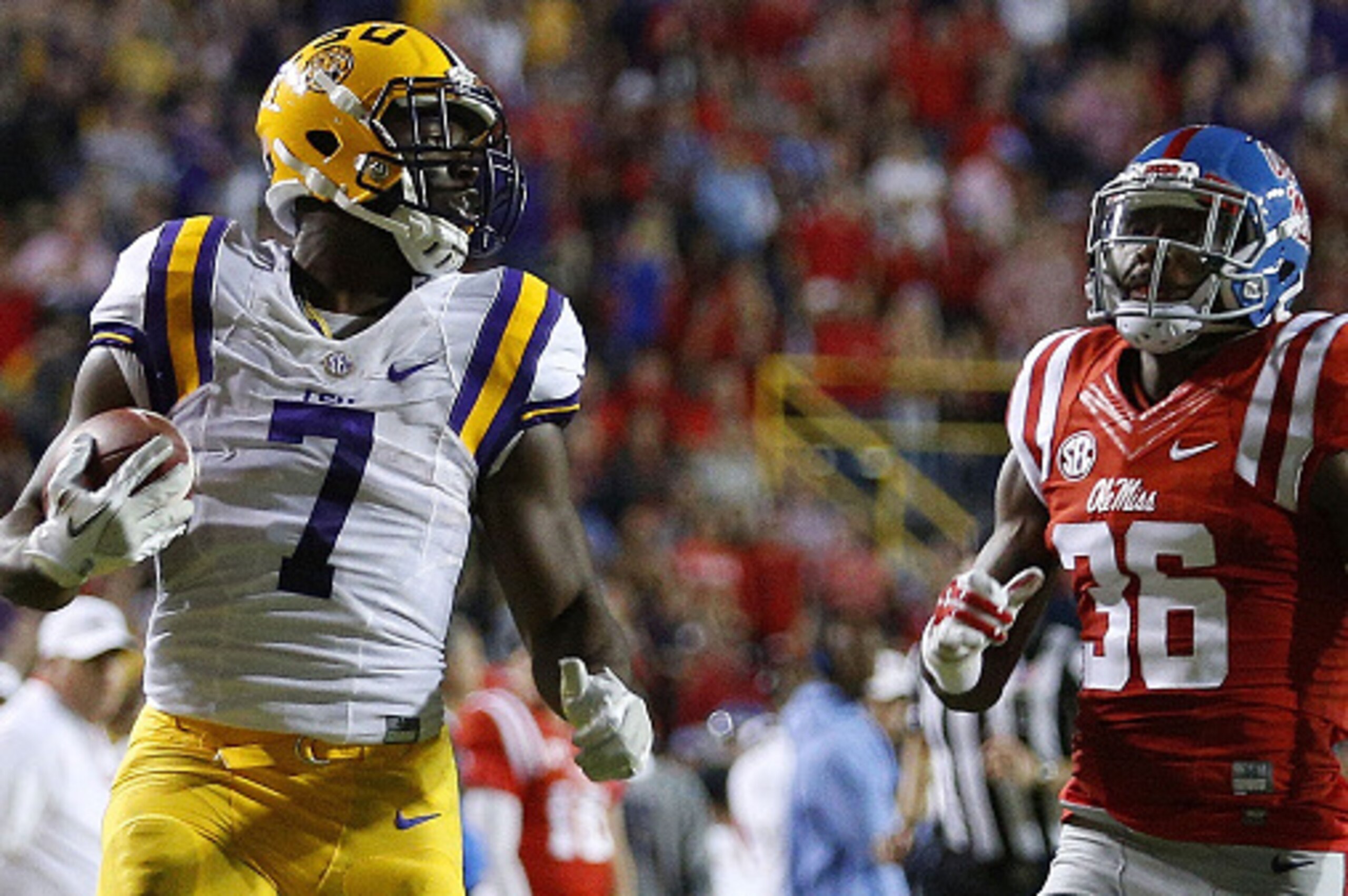 BATON ROUGE, LA - OCTOBER 22:  Leonard Fournette #7 of the LSU Tigers runs past Zedrick Woods #36 of the Mississippi Rebels for a 76-yard touchdown during the first half of a game at Tiger Stadium on October 22, 2016 in Baton Rouge, Louisiana.  (Photo by 