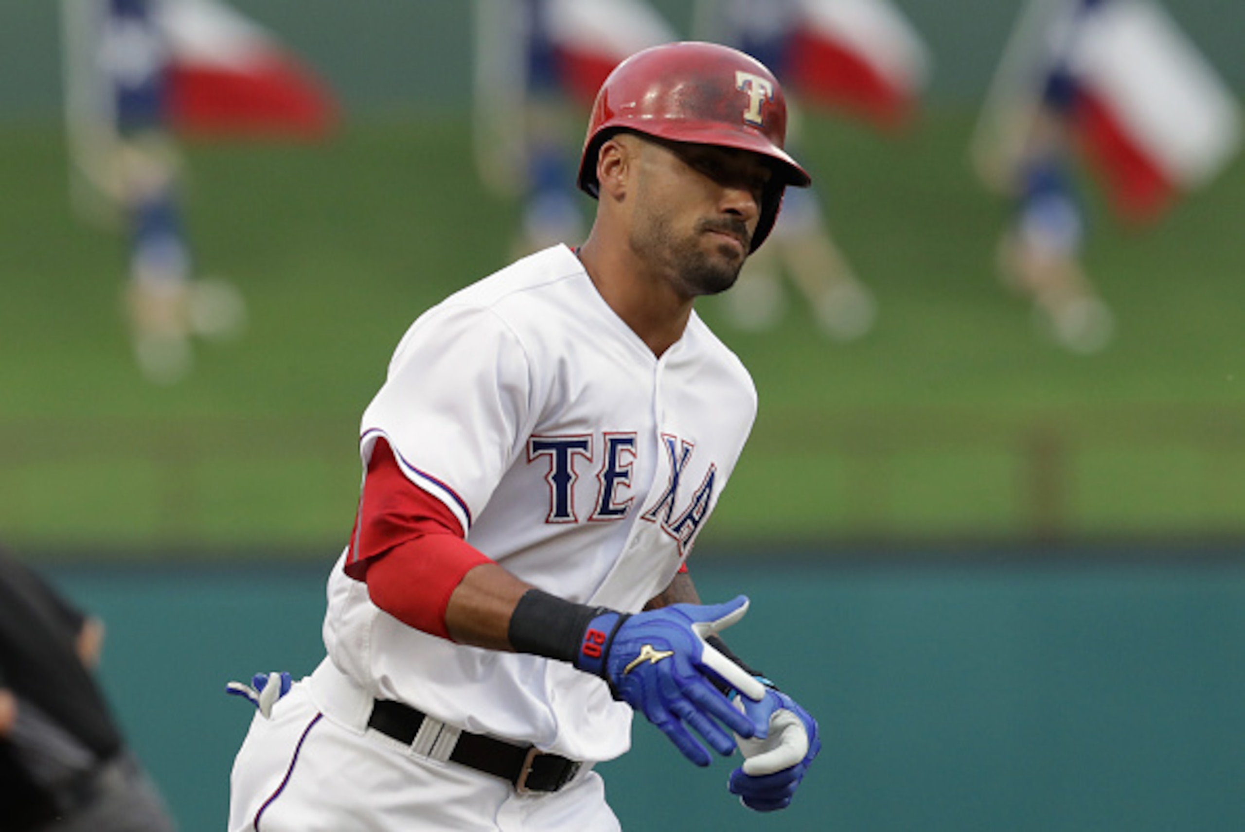 ARLINGTON, TX - JULY 25:  Ian Desmond #20 of the Texas Rangers runs the bases after a homerun against the Oakland Athletics in the first inning at Globe Life Park in Arlington on July 25, 2016 in Arlington, Texas.  (Photo by Ronald Martinez/Getty Images)