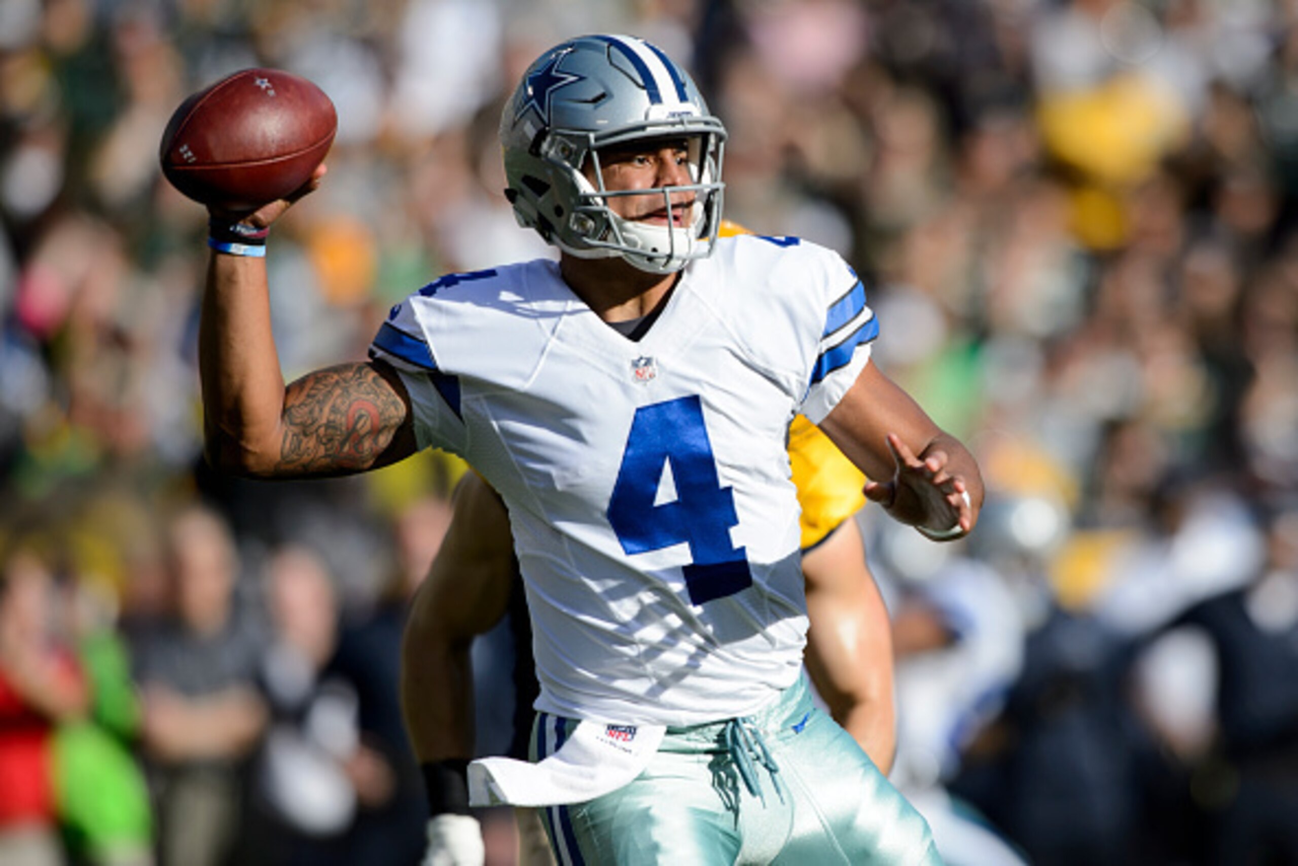GREEN BAY, WI - OCTOBER 16: Dak Prescott #4 of the Dallas Cowboys passes the ball against the Green Bay Packers during the game on October 16, 2016 at Lambeau Field in Green Bay, Wisconsin. The Cowboys defeated the Packers 30-16. (Photo by Hannah Foslien/