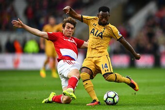 MIDDLESBROUGH, ENGLAND - SEPTEMBER 24:  Marten de Roon of Middlesbrough (L) tackles Georges-Kevin Nkoudou of Tottenham Hotspur (R) during the Premier League match between Middlesbrough and Tottenham Hotspur at the Riverside Stadium on September 24, 2016 i