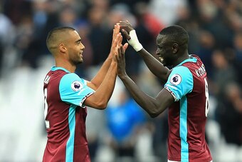 LONDON, ENGLAND - OCTOBER 22: Winston Reid of West Ham United (L) and Cheikhou Kouyate of West Ham United (R) high ten after the final whistle during the Premier League match between West Ham United and Sunderland at Olympic Stadium on October 22, 2016 in