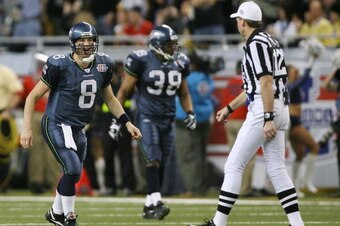 DETROIT - FEBRUARY 05:  Quarterback Matt Hasselbeck #8 of the Seattle Seahawks argues a call with referee Bill Leavy after throwing a pass out of bounds to receiver Darrell Jackson #82 in the second quarter against the Pittsburgh Steelers in Super Bowl XL