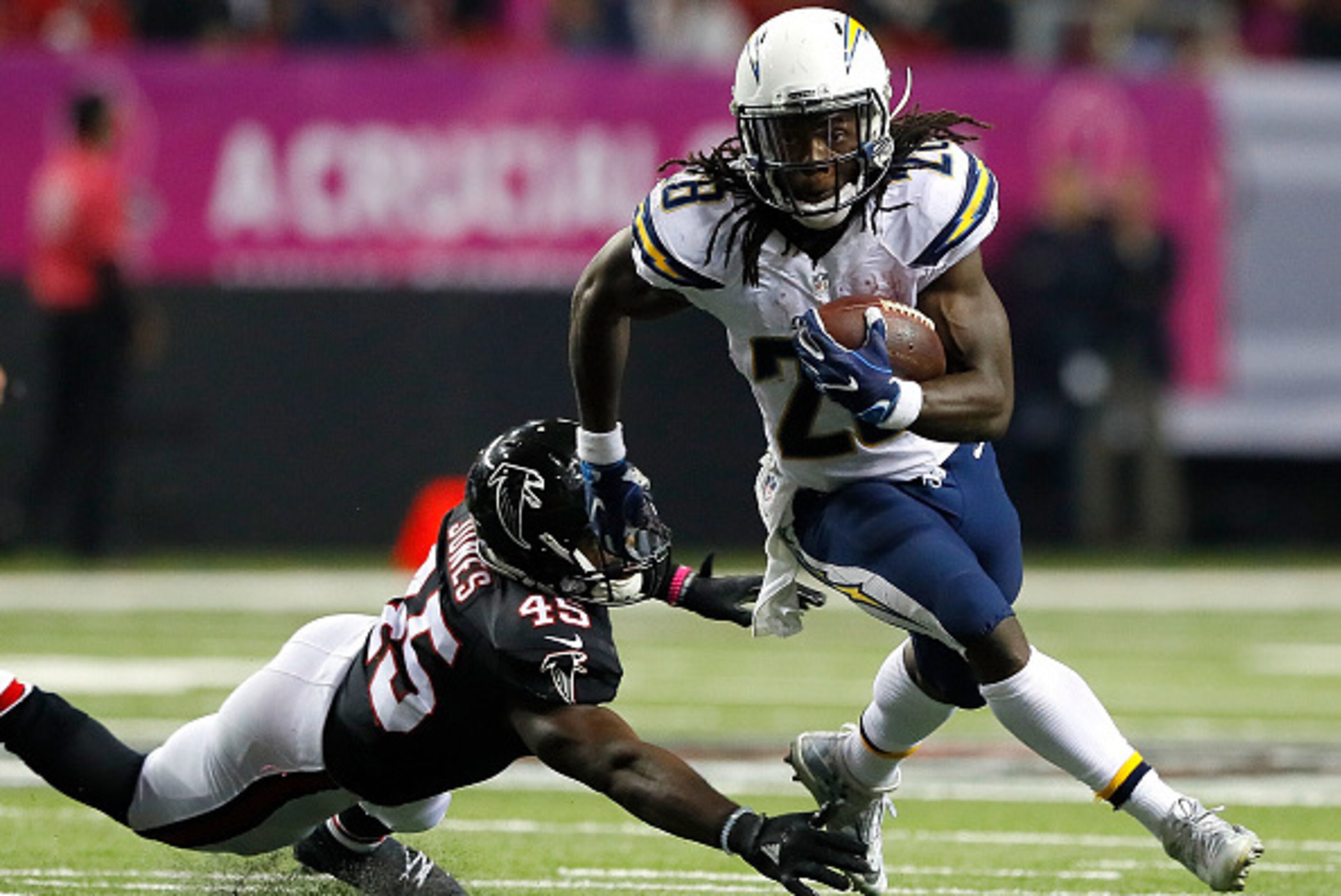 ATLANTA, GA - OCTOBER 23:  Melvin Gordon #28 of the San Diego Chargers rushes away from Deion Jones #45 of the Atlanta Falcons at Georgia Dome on October 23, 2016 in Atlanta, Georgia.  (Photo by Kevin C. Cox/Getty Images)