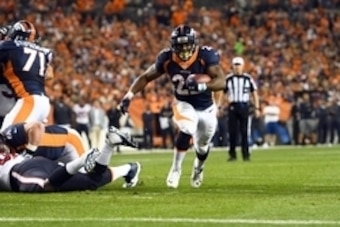 Oct 24, 2016; Denver, CO, USA; Denver Broncos running back C.J. Anderson (22) carries the ball for a touchdown in the second quarter against the Houston Texans at Sports Authority Field at Mile High. Mandatory Credit: Ron Chenoy-USA TODAY Sports