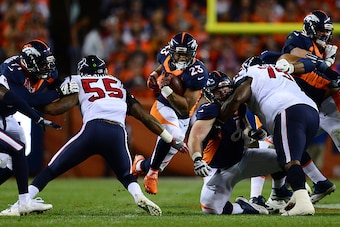 DENVER, CO - OCTOBER 24:  Running back Devontae Booker #23 of the Denver Broncos rushes for 10 yards in the second quarter of the game against the Houston Texans at Sports Authority Field at Mile High on October 24, 2016 in Denver, Colorado. (Photo by Dus