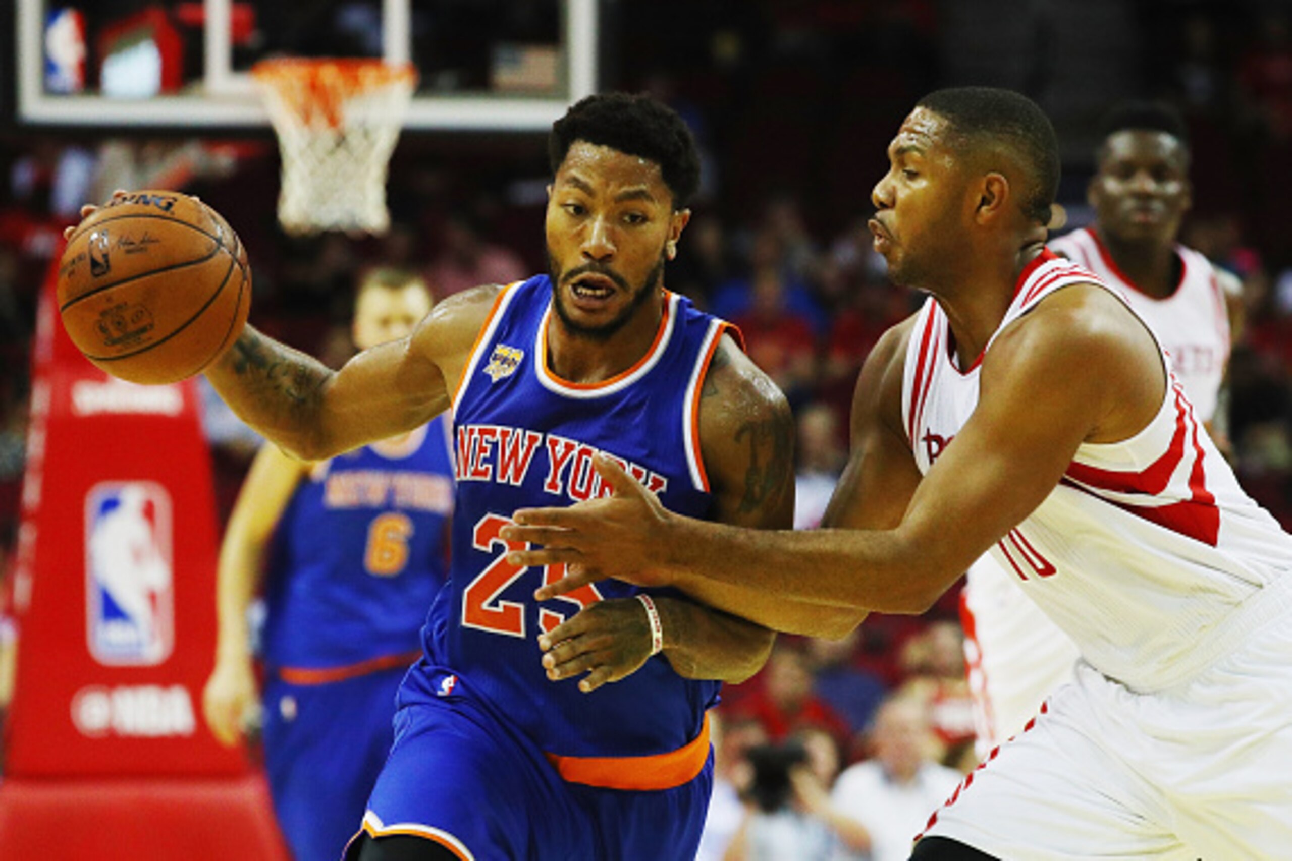 HOUSTON, TX - OCTOBER 04:  Derrick Rose #25 of the New York Knicks drives with the basketball against Eric Gordon #10 of the Houston Rockets during their game at the Toyota Center on October 4, 2016 in Houston, Texas. NOTE TO USER: User expressly acknowle