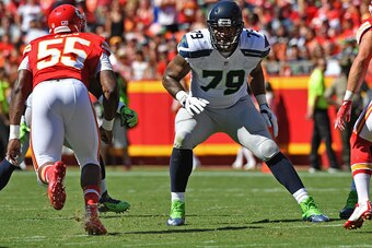 KANSAS CITY, MO - AUGUST 13:  Offensive tackle Garry Gilliam #79 of the Seattle Seahawks gets set on the line against the Kansas City Chiefs during the first half on August 13, 2016 at Arrowhead Stadium in Kansas City, Missouri.  (Photo by Peter G. Aiken/
