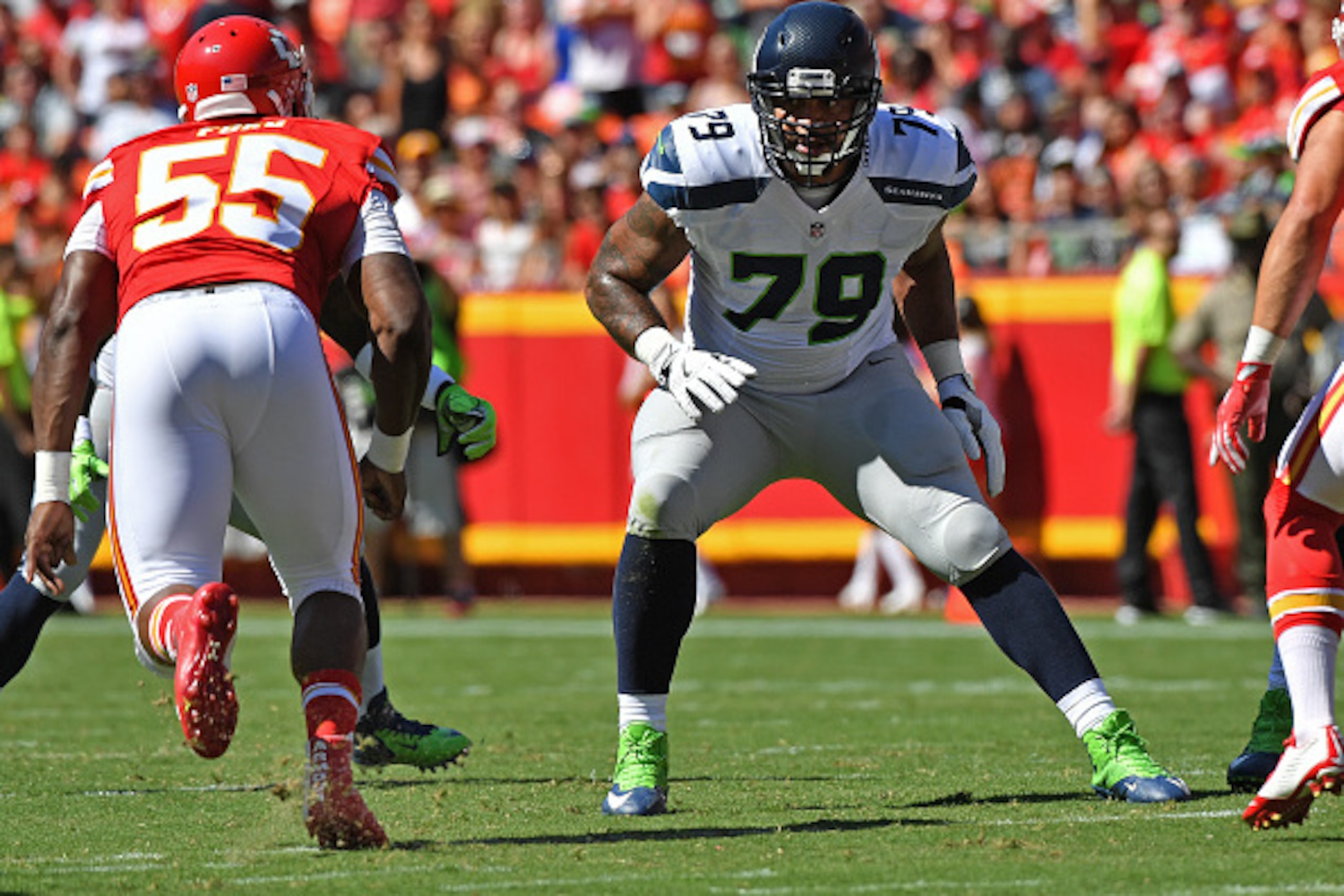 KANSAS CITY, MO - AUGUST 13:  Offensive tackle Garry Gilliam #79 of the Seattle Seahawks gets set on the line against the Kansas City Chiefs during the first half on August 13, 2016 at Arrowhead Stadium in Kansas City, Missouri.  (Photo by Peter G. Aiken/