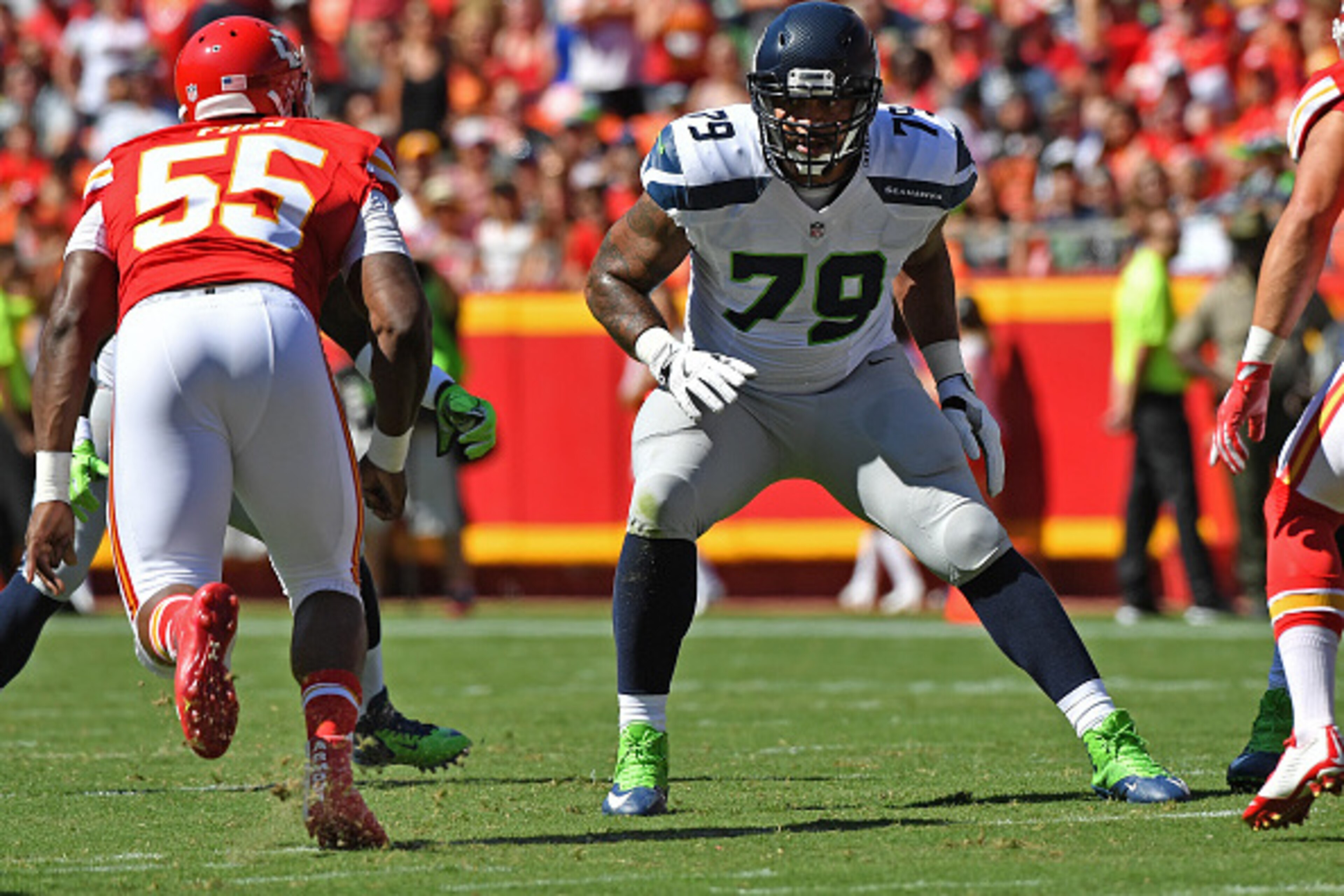 KANSAS CITY, MO - AUGUST 13:  Offensive tackle Garry Gilliam #79 of the Seattle Seahawks gets set on the line against the Kansas City Chiefs during the first half on August 13, 2016 at Arrowhead Stadium in Kansas City, Missouri.  (Photo by Peter G. Aiken/