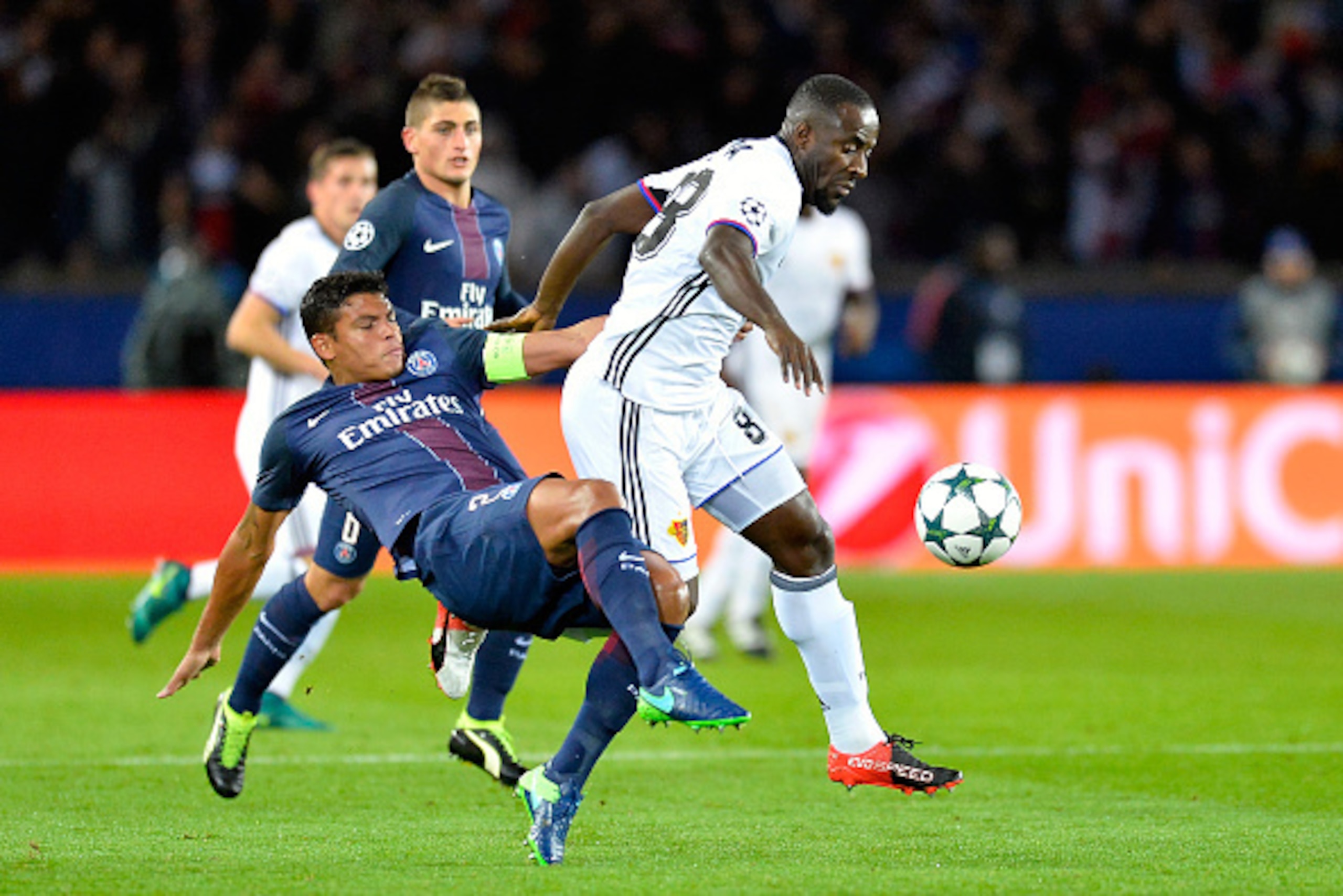 PARIS, FRANCE - OCTOBER 19:  Thiago Silva of Paris Saint-Germain and Seydou Doumbia of FC Basel 1893 fight for the ball during the UEFA Champions League match between Paris Saint-Germain and FC Basel 1893 at Parc des Princes on October 19, 2016 in Paris, 