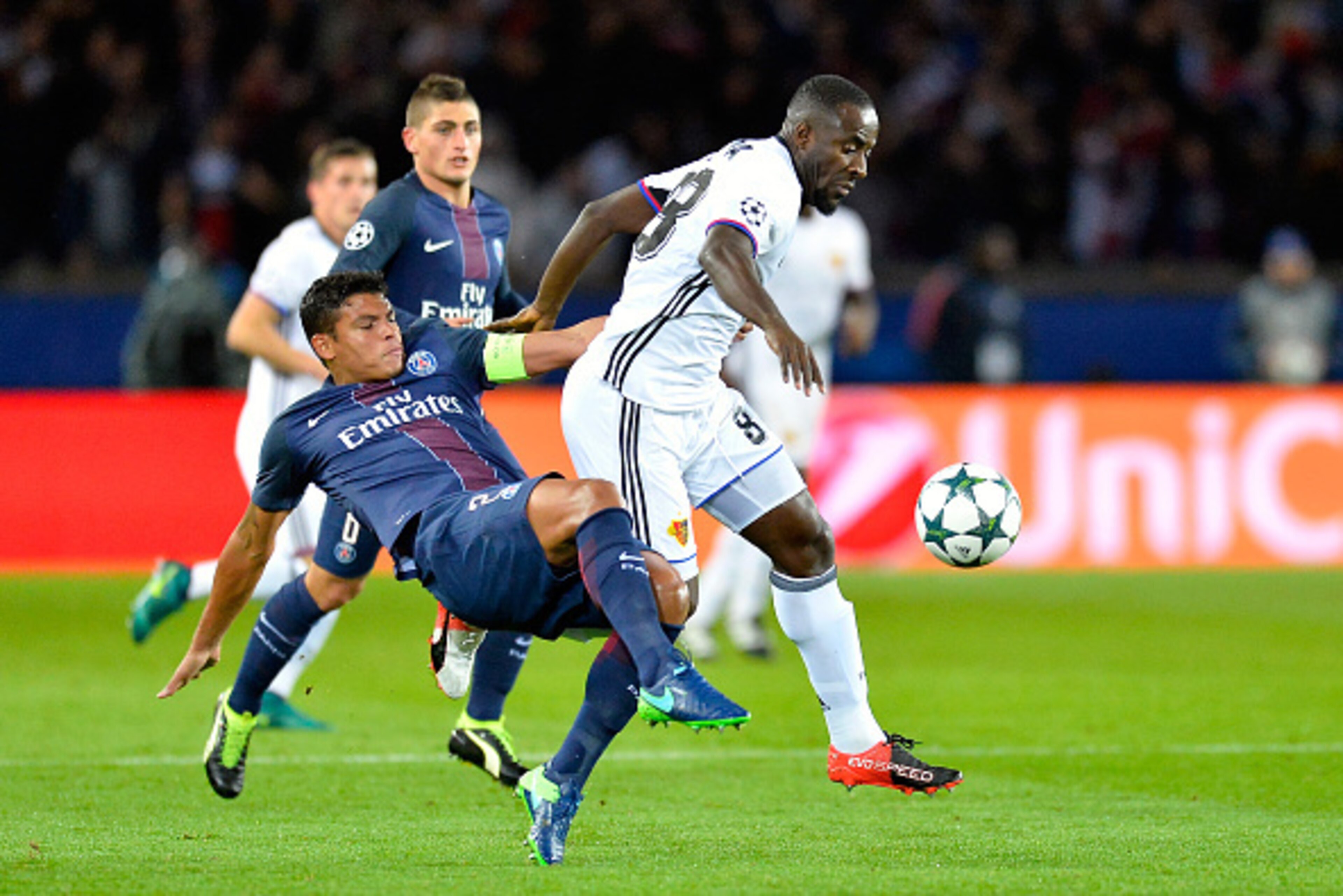 PARIS, FRANCE - OCTOBER 19:  Thiago Silva of Paris Saint-Germain and Seydou Doumbia of FC Basel 1893 fight for the ball during the UEFA Champions League match between Paris Saint-Germain and FC Basel 1893 at Parc des Princes on October 19, 2016 in Paris, 