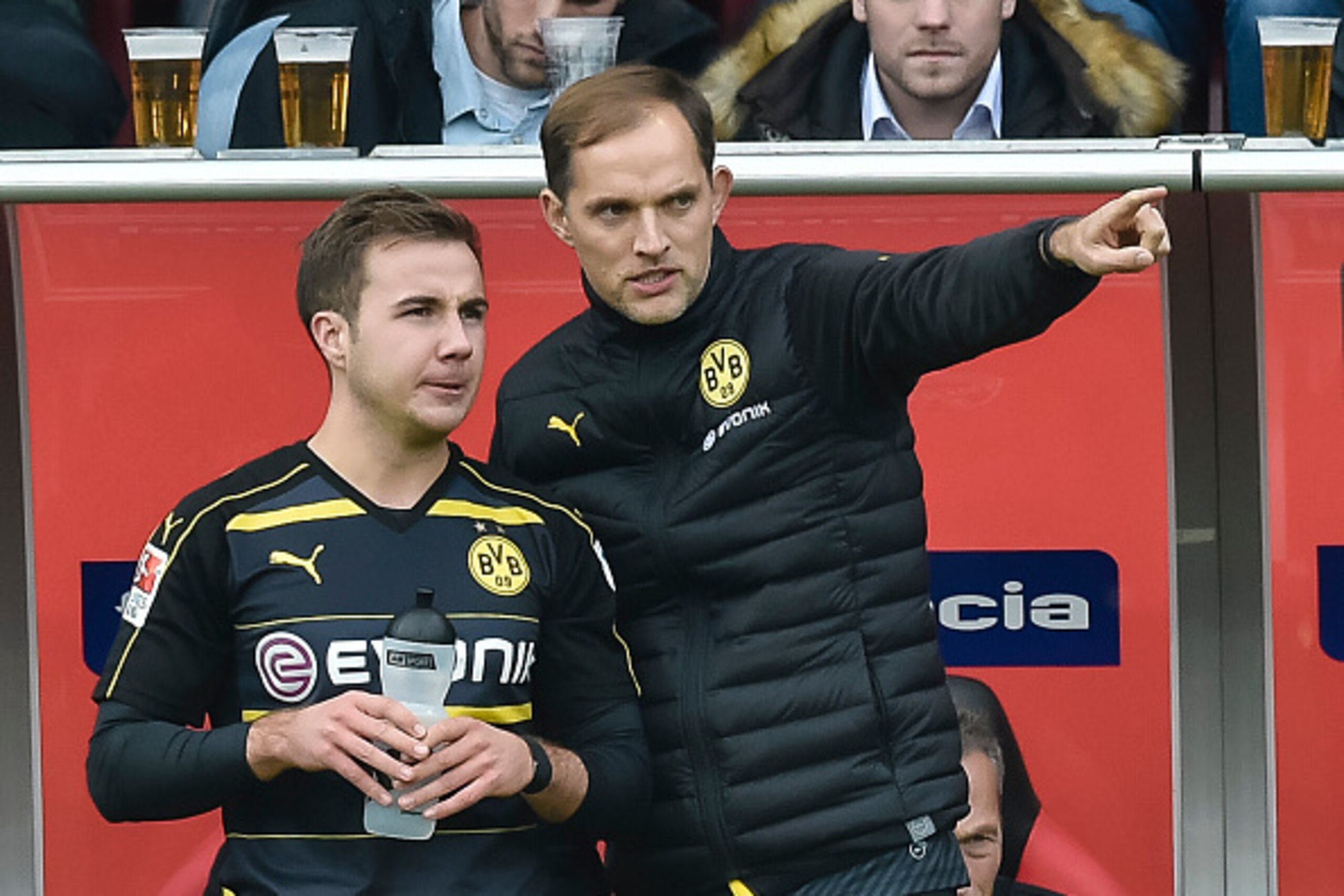 Dortmund's head coach Thomas Tuchel gives Dortmund's midfielder Mario Goetze instructions during the German first division Bundesliga football match between FC Ingolstadt 04 and Borussia Dortmund in Ingolstadt, southern Germany, on October 22, 2016. / AFP