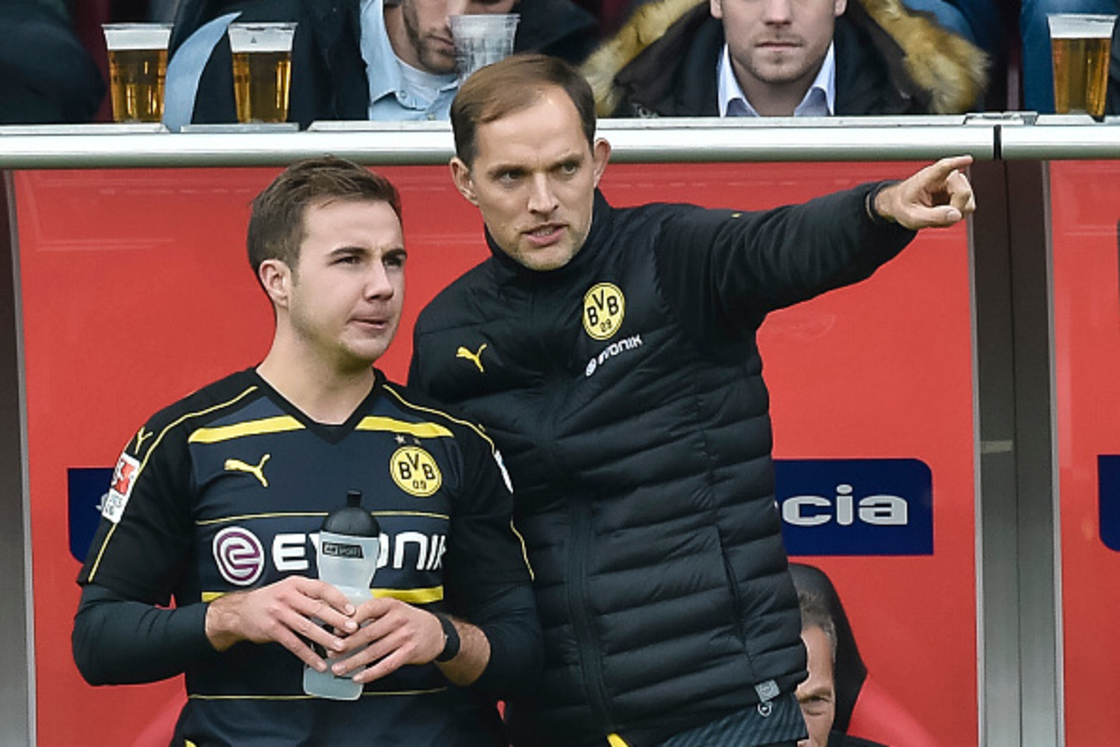 Dortmund's head coach Thomas Tuchel gives Dortmund's midfielder Mario Goetze instructions during the German first division Bundesliga football match between FC Ingolstadt 04 and Borussia Dortmund in Ingolstadt, southern Germany, on October 22, 2016. / AFP