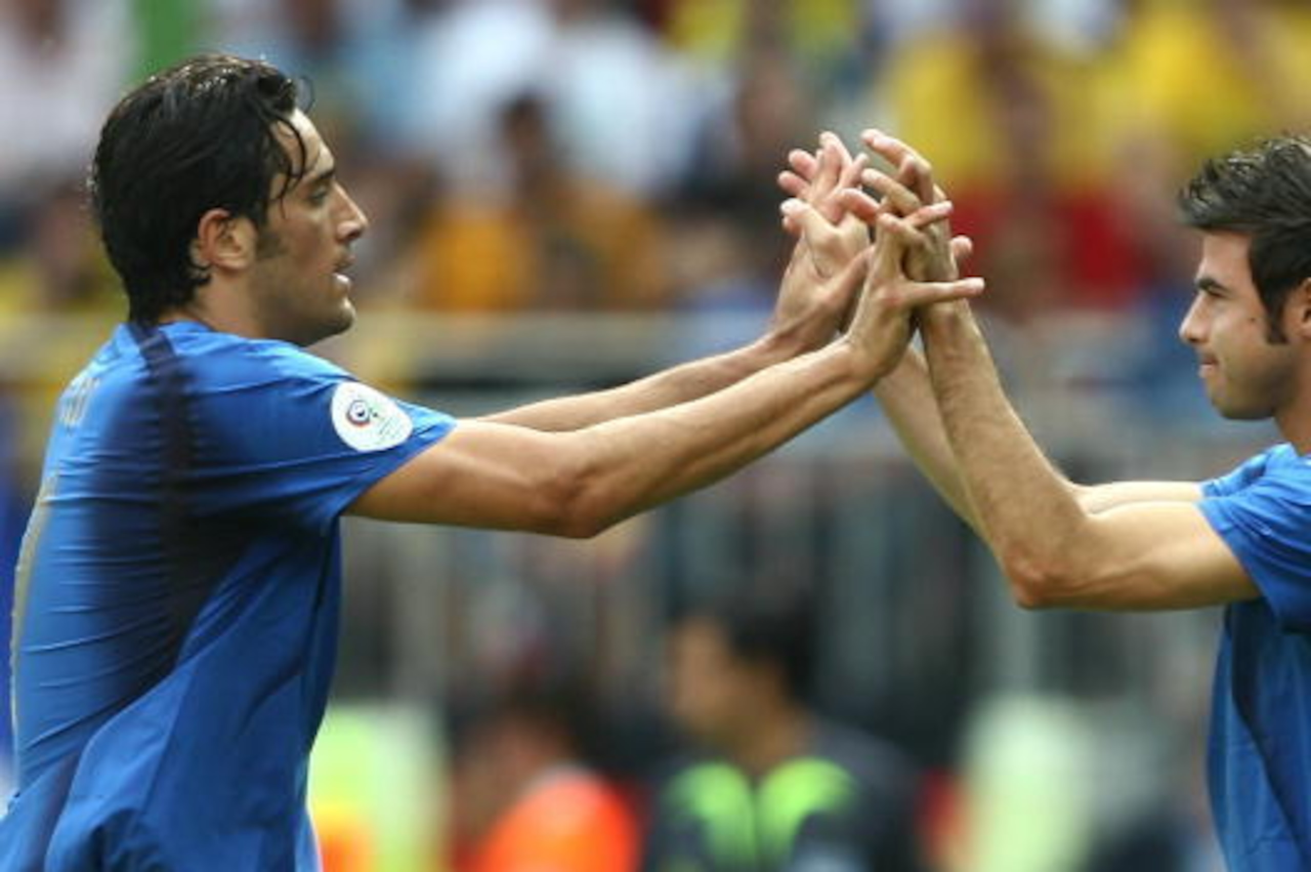 Kaiserslautern, GERMANY: Italian forward Luca Toni (L) shakes hands with Italian defender Andrea Barzagli (R) as he is substituted for in the second half during the round of 16 World Cup football match between Italy and Australia at Kaiserslautern's Frit Kaiserslautern, GERMANY: Italian forward Luca Toni (L) shakes hands with Italian defender Andrea Barzagli (R) as he is substituted for in the second half during the round of 16 World Cup football match between Italy and Australia at Kaiserslautern's Frit