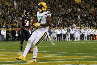 GREENBAY, WI - OCTOBER 20: Wide receiver Davante Adams #17 of the Green Bay Packers scores a fourth quarter touchdown past inside linebacker Jerrell Freeman #50 of the Chicago Bears at Lambeau Field on October 20, 2016 in Green Bay, Wisconsin. (Photo by D