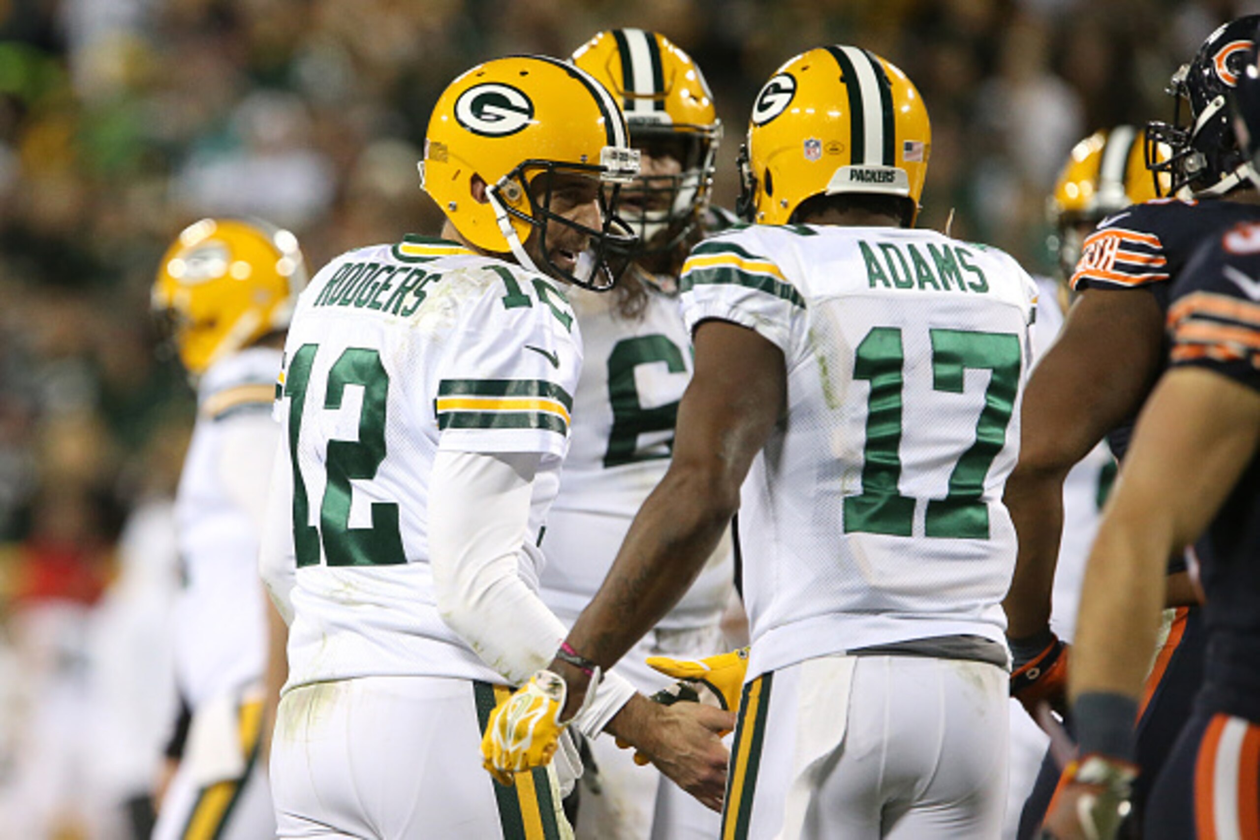 GREENBAY, WI - OCTOBER 20: Quarterback Aaron Rodgers #12 of the Green Bay Packers talks with teammate wide receiver Davante Adams #17 in the third quarter against the Chicago Bears at Lambeau Field on October 20, 2016 in Green Bay, Wisconsin. (Photo by Dy