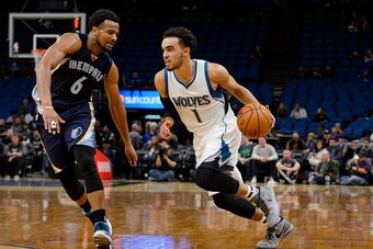 MINNEAPOLIS, MN - OCTOBER 19: Tyus Jones #1 of the Minnesota Timberwolves drives to the basket against Chris Crawford #6 of the Memphis Grizzlies during the preseason game on October 19, 2016 at Target Center in Minneapolis, Minnesota. NOTE TO USER: User 