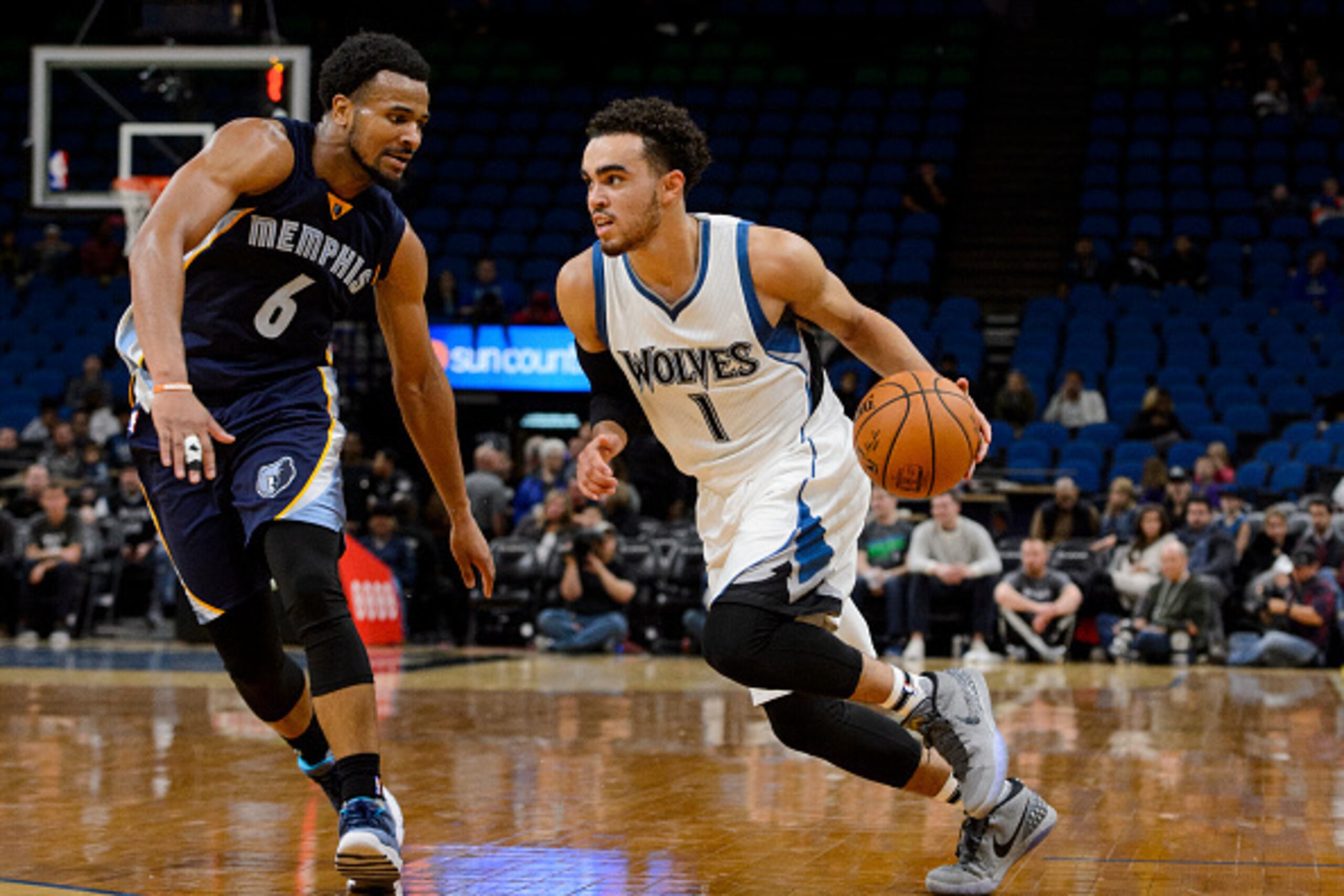 MINNEAPOLIS, MN - OCTOBER 19: Tyus Jones #1 of the Minnesota Timberwolves drives to the basket against Chris Crawford #6 of the Memphis Grizzlies during the preseason game on October 19, 2016 at Target Center in Minneapolis, Minnesota. NOTE TO USER: User 