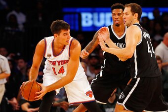 NEW YORK, NY - OCTOBER 08:  (NEW YORK DAILIES OUT)    Willy Hernangomez #14 of the New York Knicks in action against Chris McCullough #1 and Bojan Bogdanovic #44 of the Brooklyn Nets at Madison Square Garden on October 8, 2016 in New York City. The Knicks