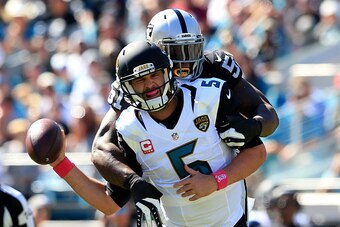 JACKSONVILLE, FL - OCTOBER 23:  Blake Bortles #5 of the Jacksonville Jaguars is tackled by Bruce Irvin
of the Oakland Raiders during the game at EverBank Field on October 23, 2016 in Jacksonville, Florida.  (Photo by Rob Foldy/Getty Images)